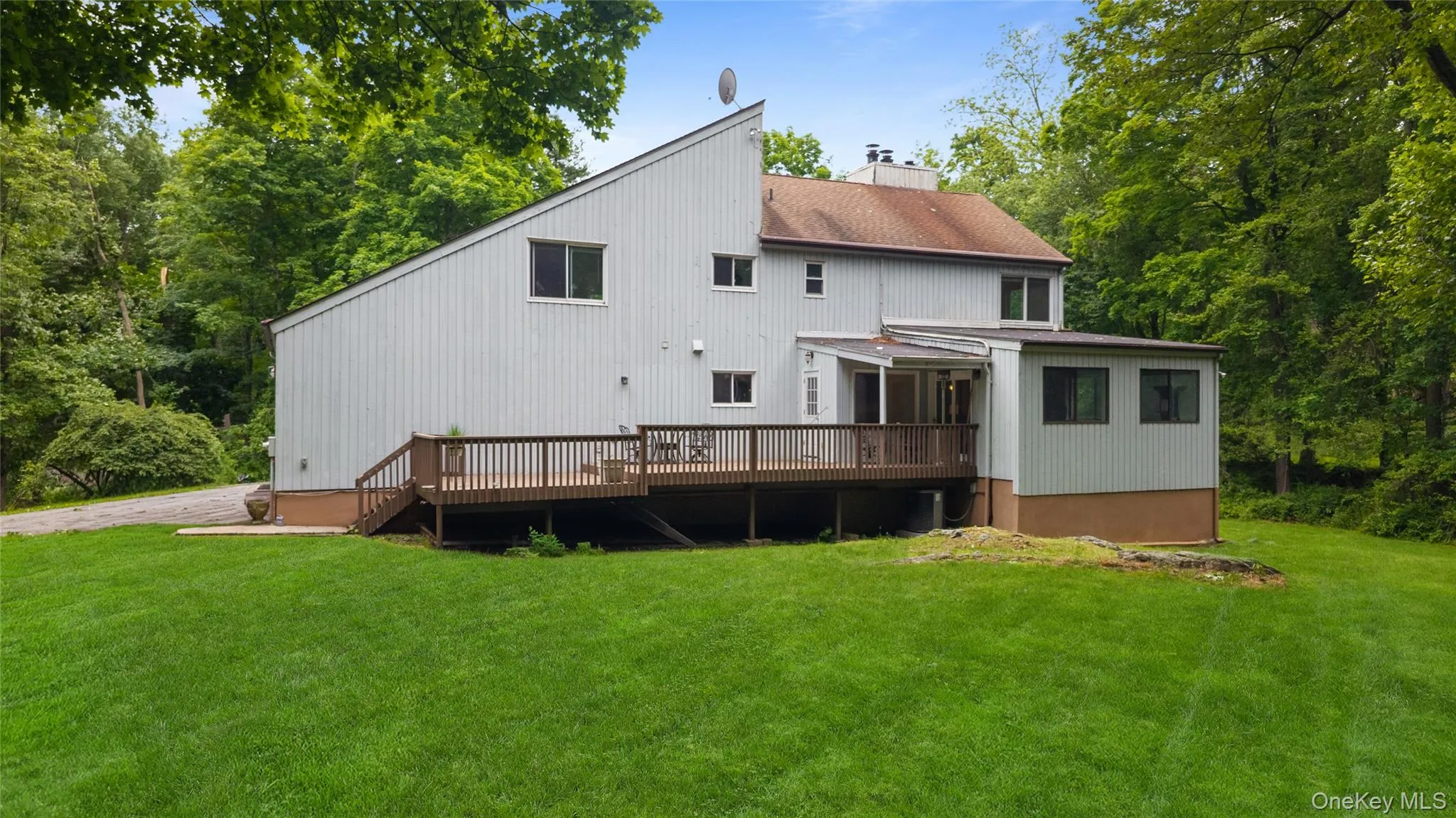 Rear view of house with nice size deck Rear view of house with nice size deck