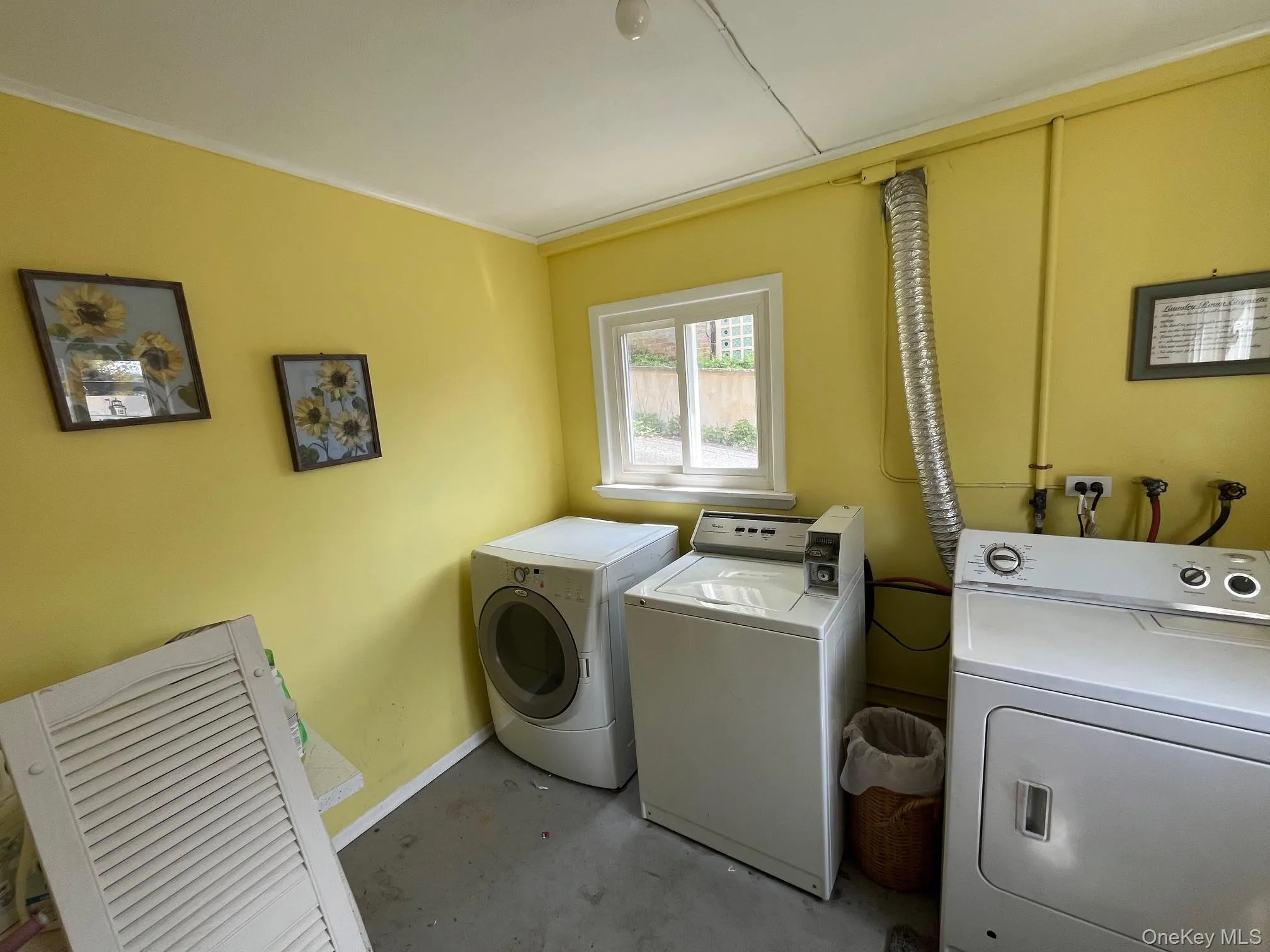 Clothes washing area with laundry area, baseboards, and washer and dryer Clothes washing area with laundry area, baseboards, and washer and dryer