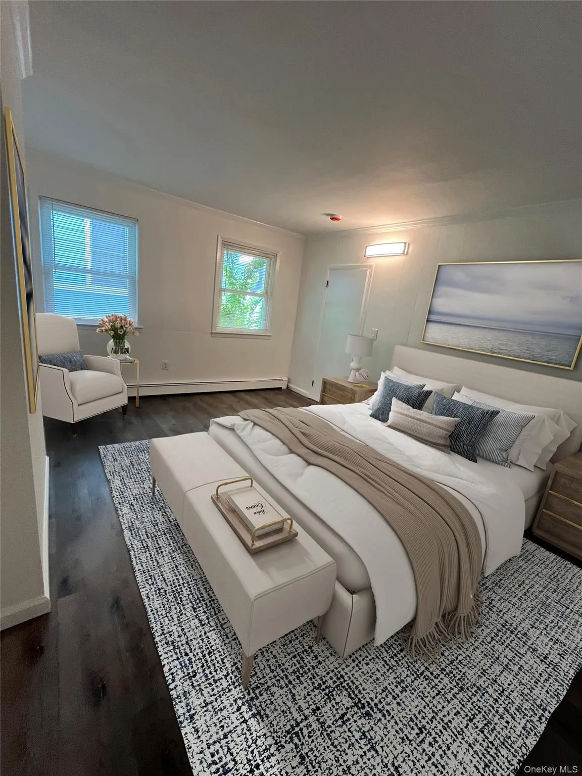 Bedroom with baseboard heating, and weathered grey flooring Bedroom with baseboard heating, and weathered grey flooring