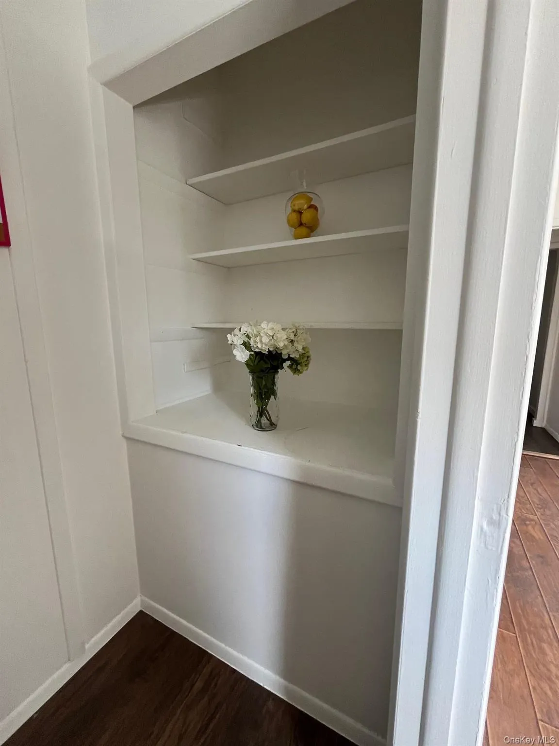 Interior details with baseboards and wood finished floors Interior details with baseboards and wood finished floors