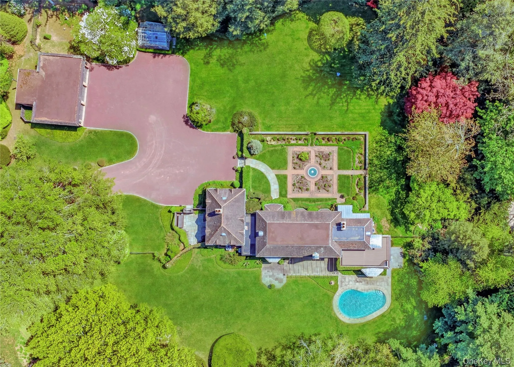 Aerial View showing 3 Car Garage and Green House Aerial View showing 3 Car Garage and Green House