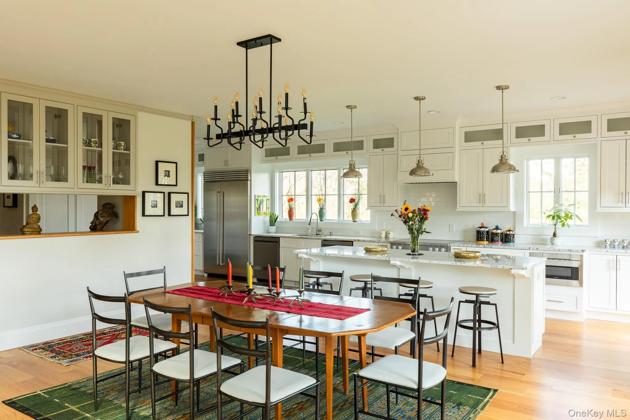 Dining room with a view of the island and kitchen Dining room with a view of the island and kitchen