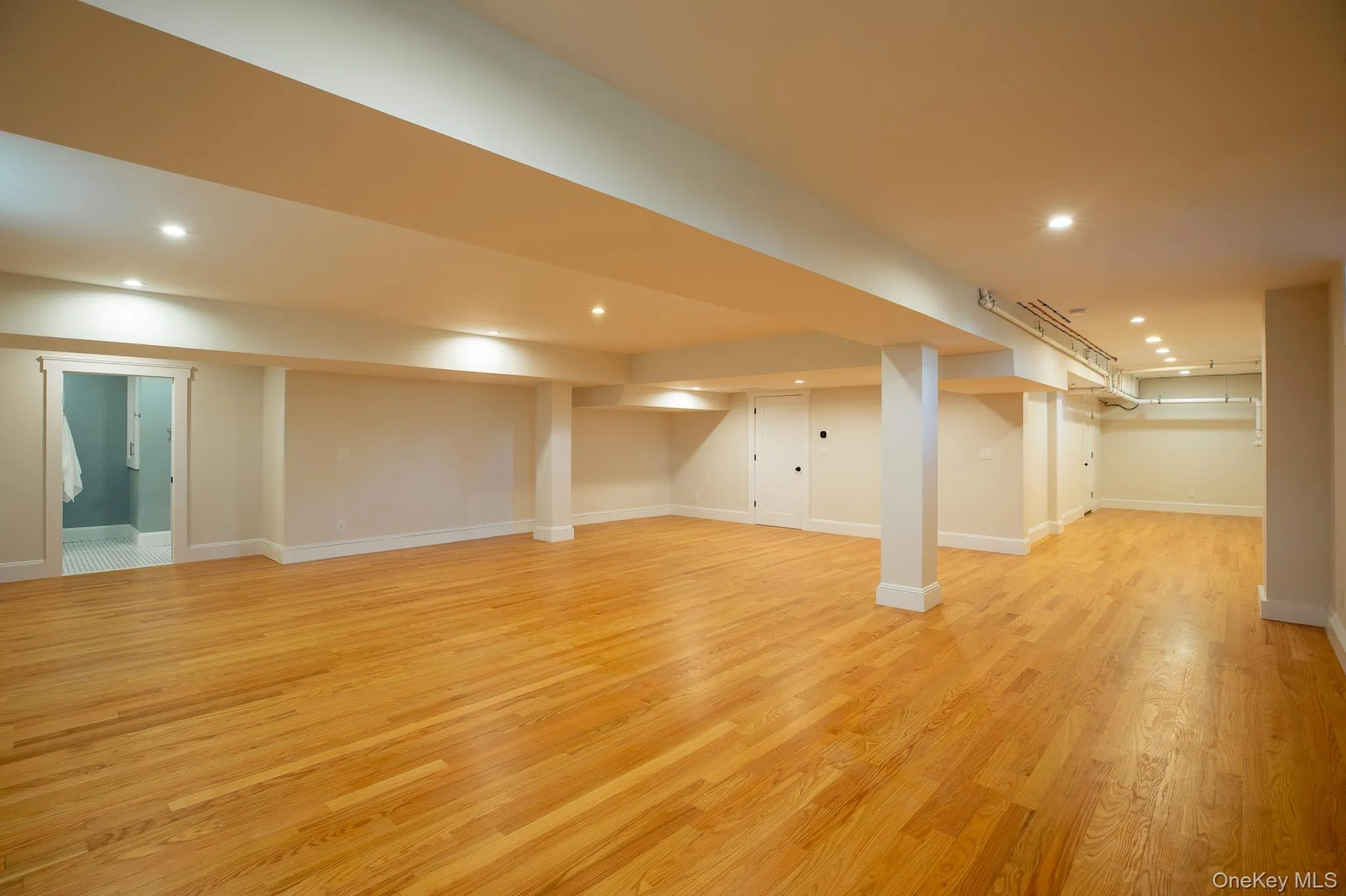 Finished basement with oak floors and full bathroom Finished basement with oak floors and full bathroom