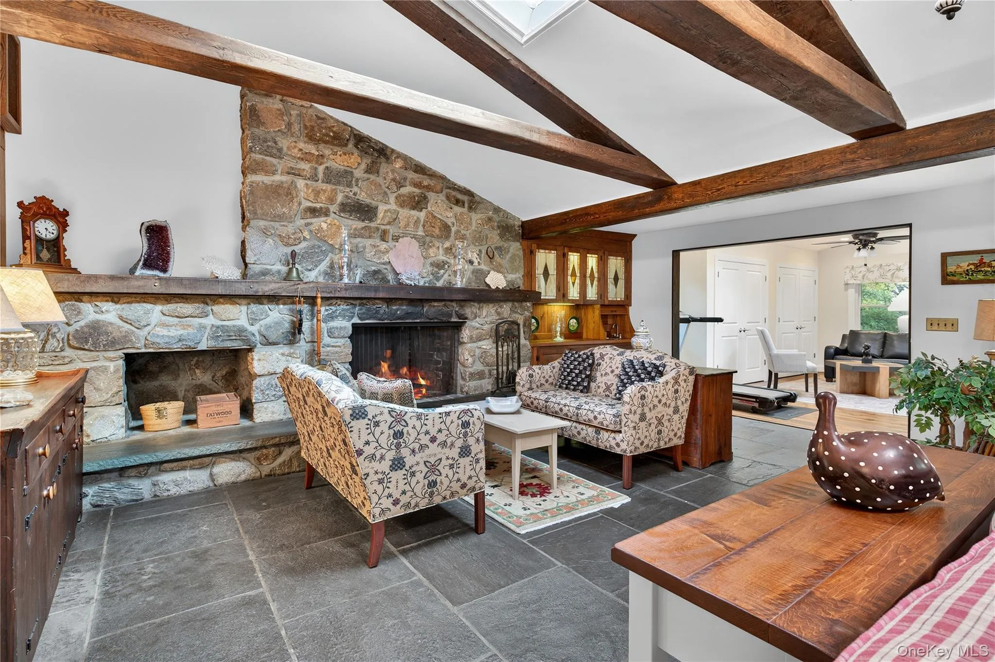 Gorgeous natural stone fireplace with wood storage. Gorgeous natural stone fireplace with wood storage.