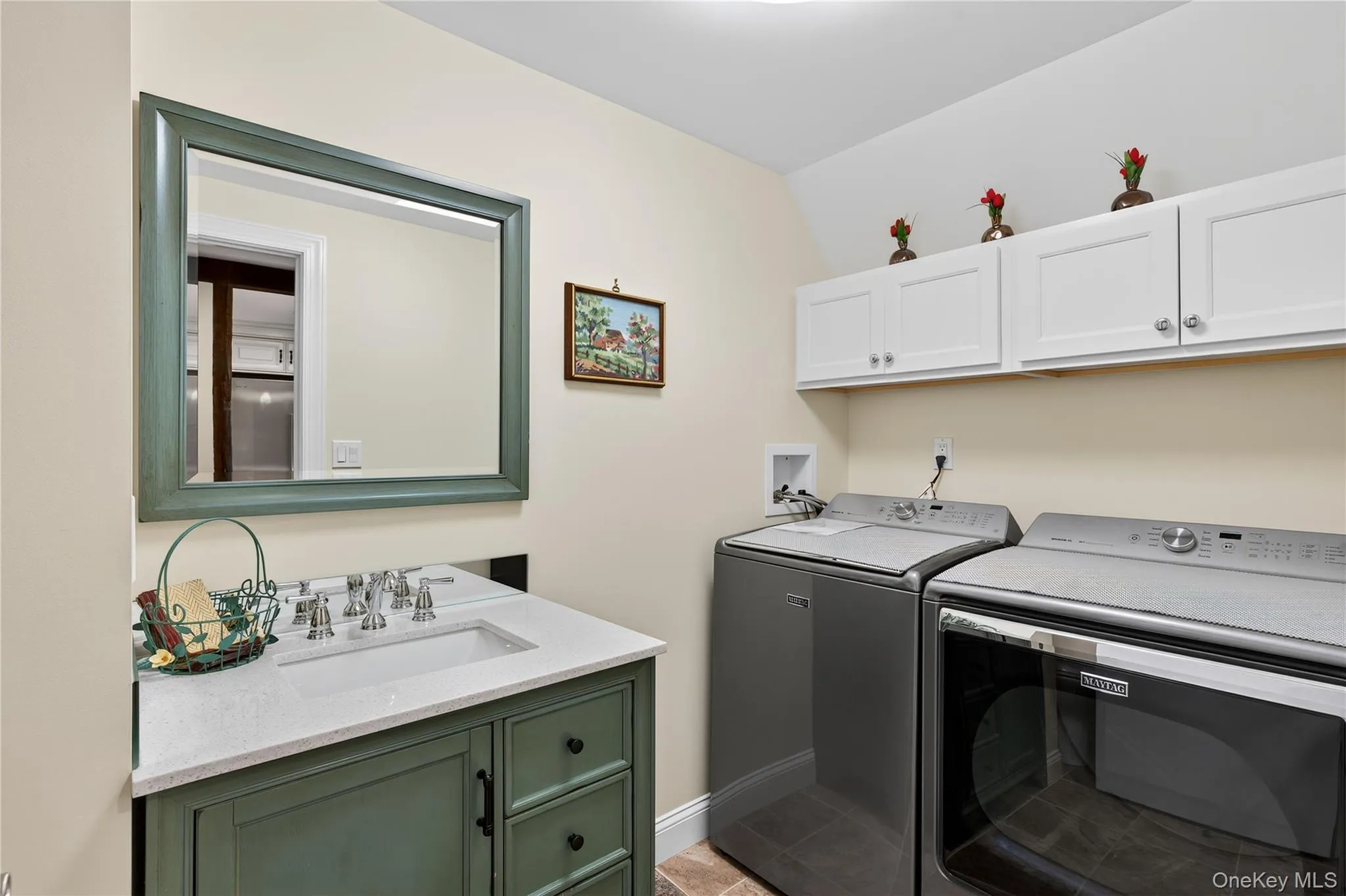 Main level powder room with laundry. Main level powder room with laundry.
