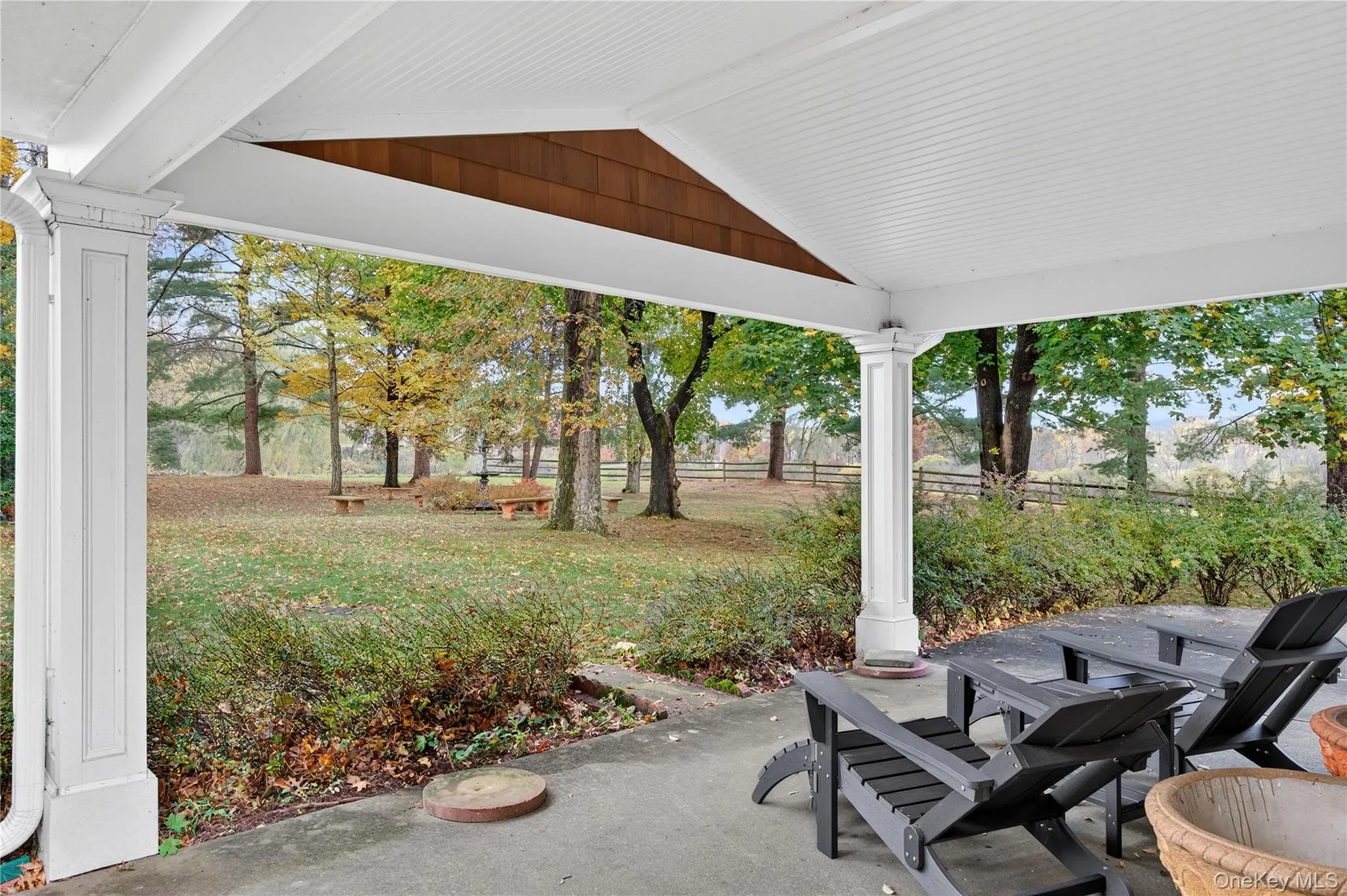 Covered side porch with adjacent open patio is a great space for gathering/entertaining. Covered side porch with adjacent open patio is a great space for gathering/entertaining.