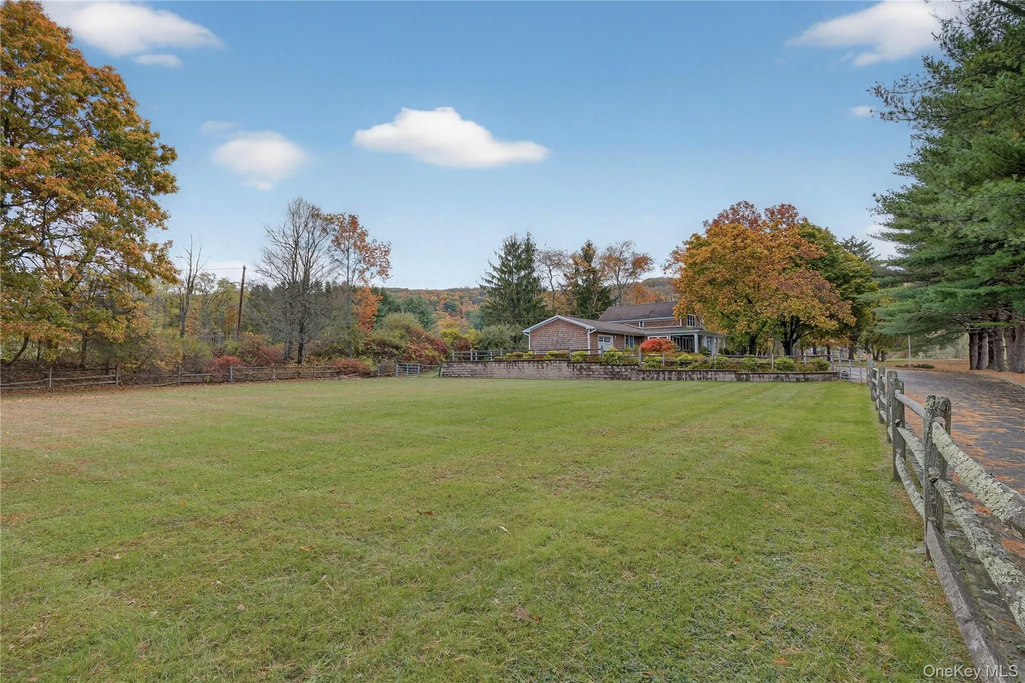 Level lawn next to residence - great spot for a pool, pool house, barn or more detached garage space. Level lawn next to residence - great spot for a pool, pool house, barn or more detached garage space.
