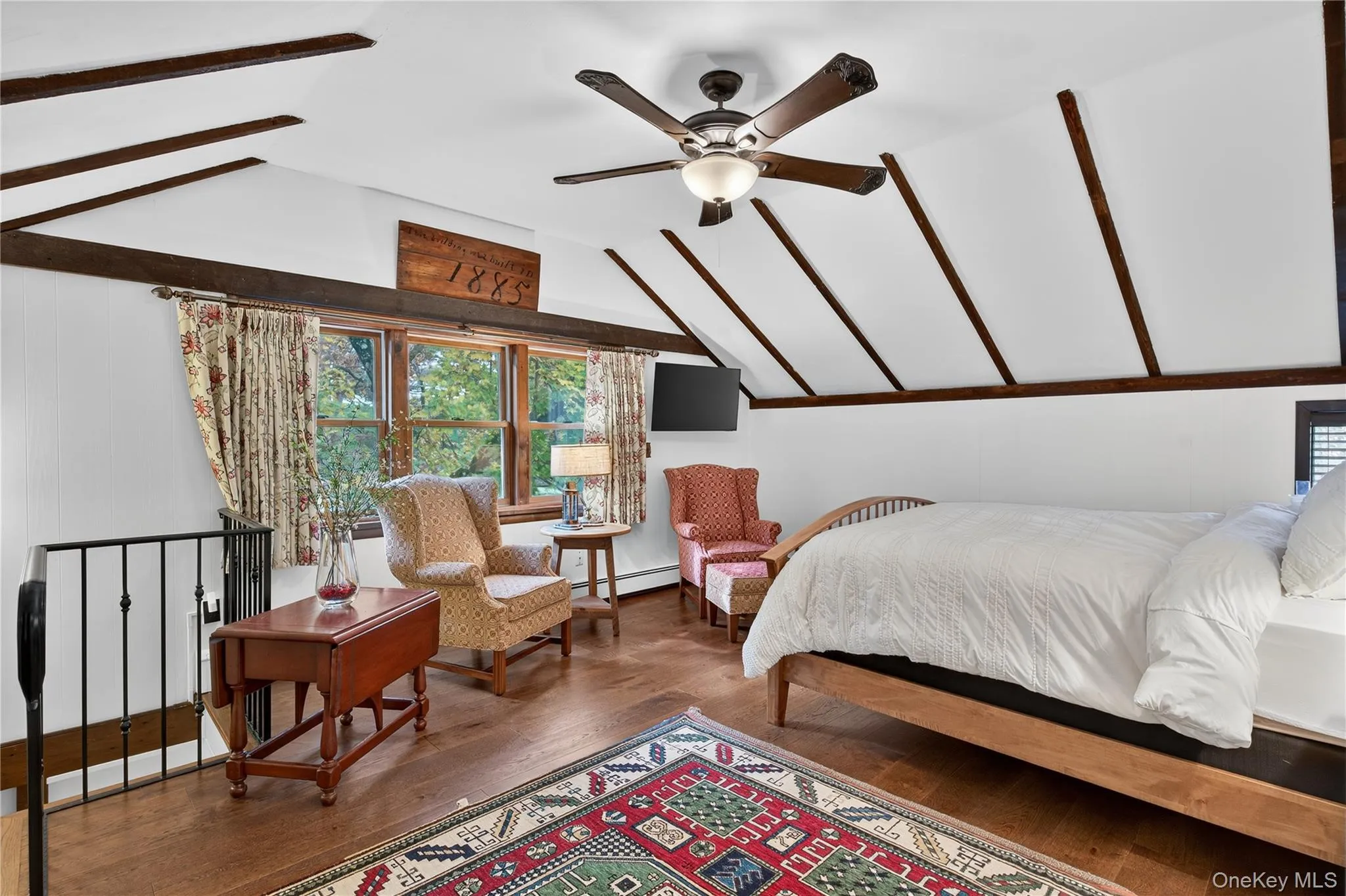 Vaulted ceiling, exposed beams, wood floors and sitting area. Vaulted ceiling, exposed beams, wood floors and sitting area.