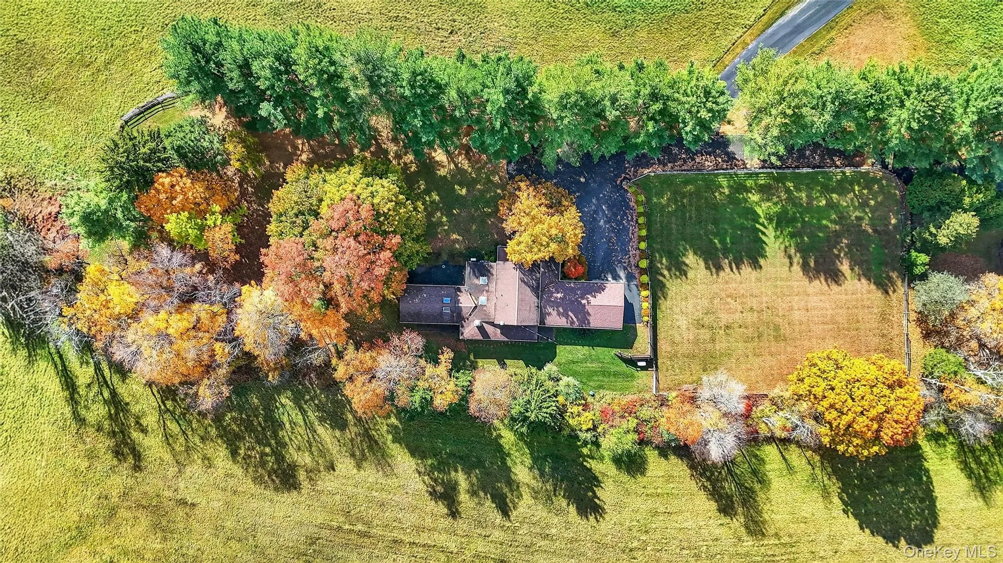 Plantings on all sides give the home a tucked away feeling, yet surrounded by open, fertile fields. Plantings on all sides give the home a tucked away feeling, yet surrounded by open, fertile fields.