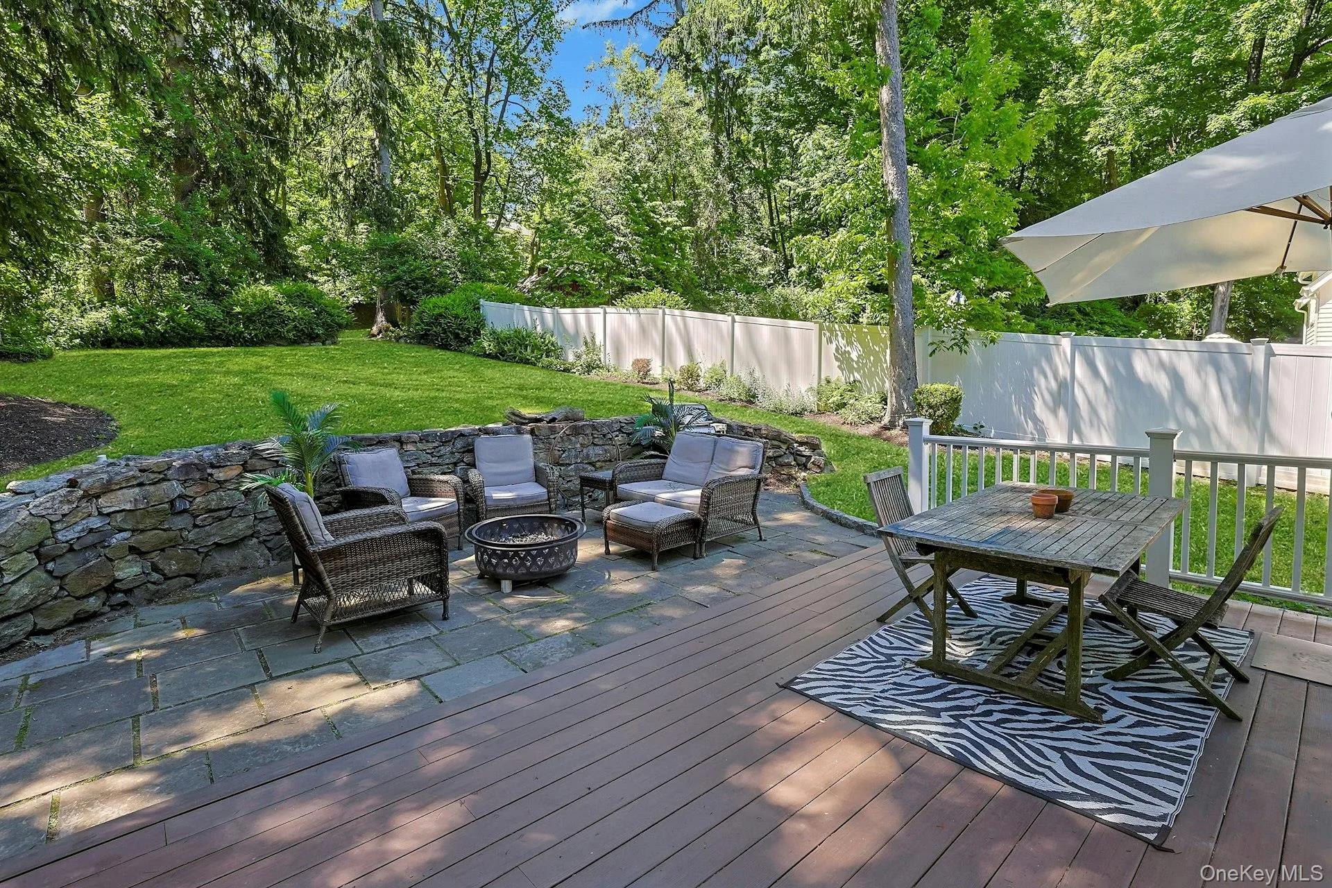Enjoy outdoor living at its best with a welcoming patio area and fire pit, perfect for relaxing evenings, gathering with friends, and taking in the peaceful surroundings. Enjoy outdoor living at its best with a welcoming patio area and fire pit, perfect for relaxing evenings, gathering with friends, and taking in the peaceful surroundings.