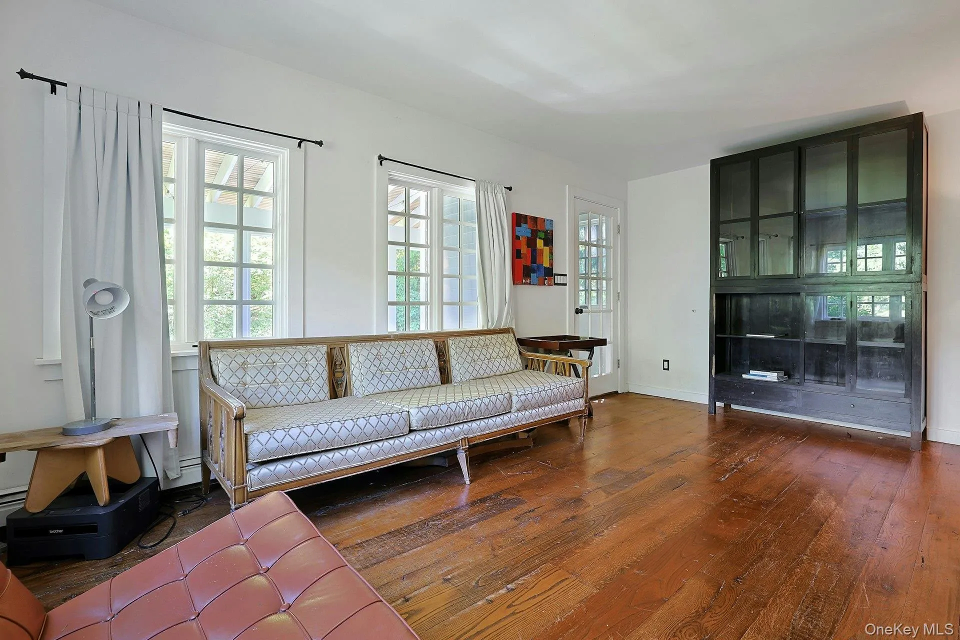 Sunlight pours in, highlighting the rich hardwood floors. Sunlight pours in, highlighting the rich hardwood floors.