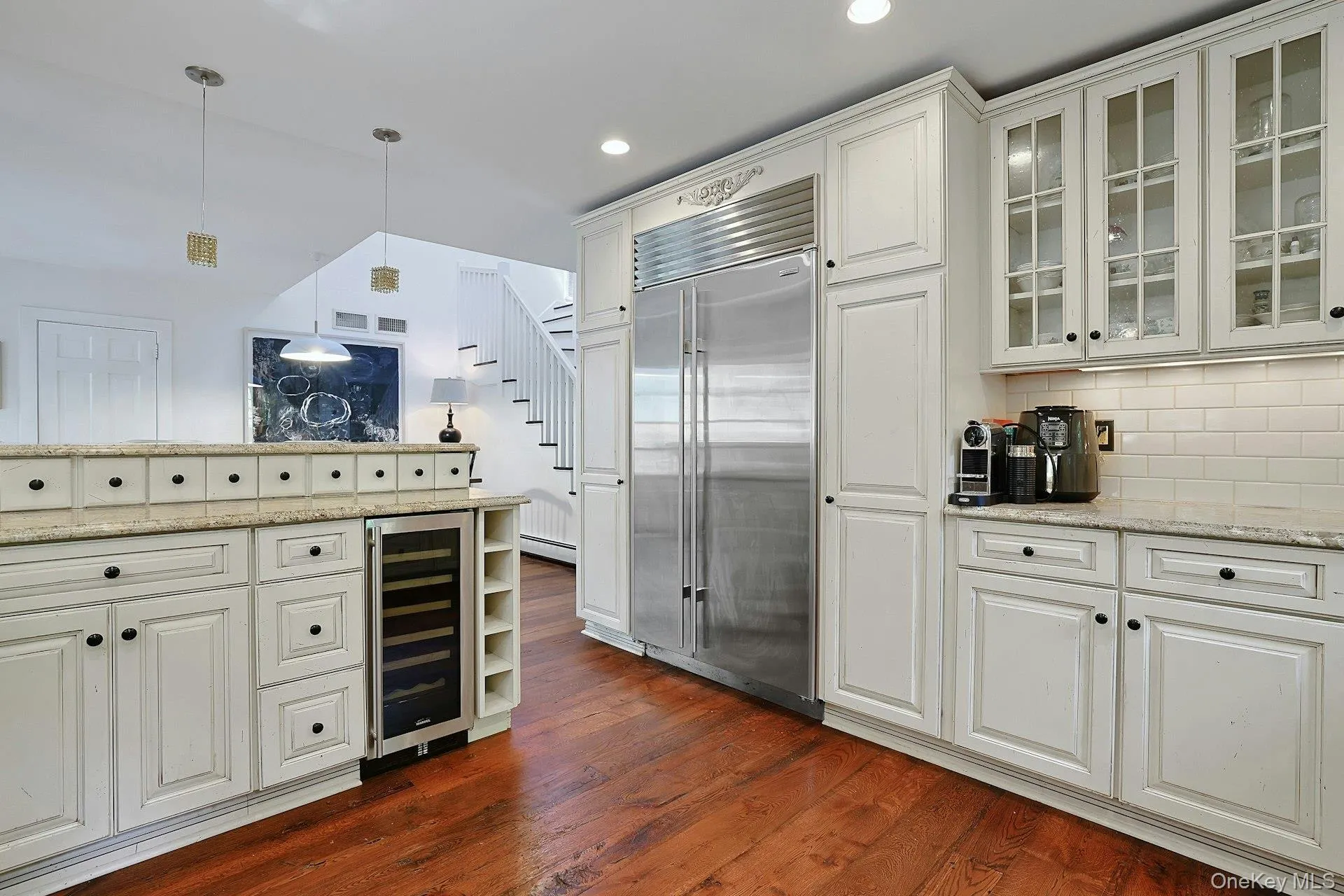 The kitchen features stainless steel appliances, beautiful finishes, and plenty of storage, creating a stylish and functional space The kitchen features stainless steel appliances, beautiful finishes, and plenty of storage, creating a stylish and functional space