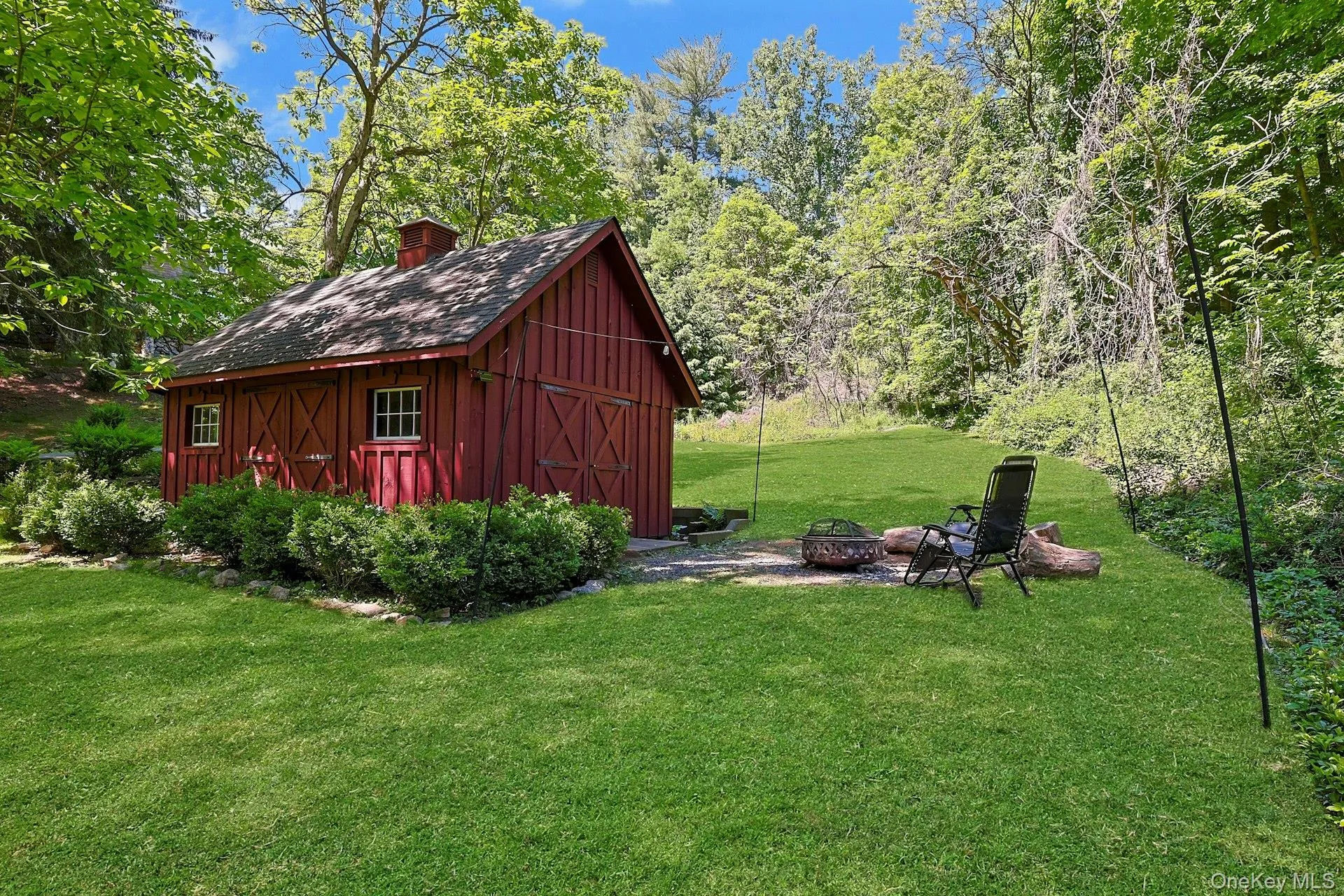 A charming barn adds character and versatility to the property, offering a beautiful complement to the expansive grounds and timeless country setting. A charming barn adds character and versatility to the property, offering a beautiful complement to the expansive grounds and timeless country setting.