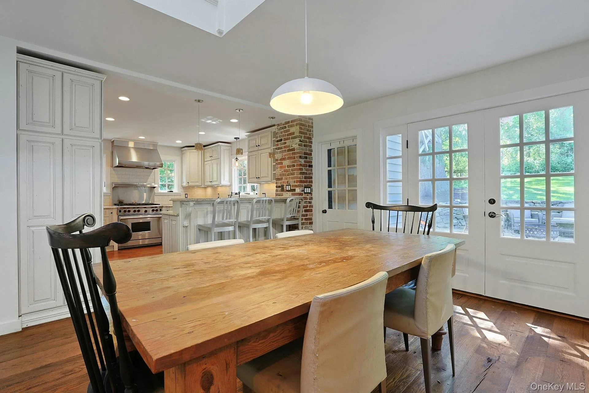 The dining area is beautifully framed by French doors that open to the patio, creating a bright, airy setting and an effortless connection to outdoor living. The dining area is beautifully framed by French doors that open to the patio, creating a bright, airy setting and an effortless connection to outdoor living.
