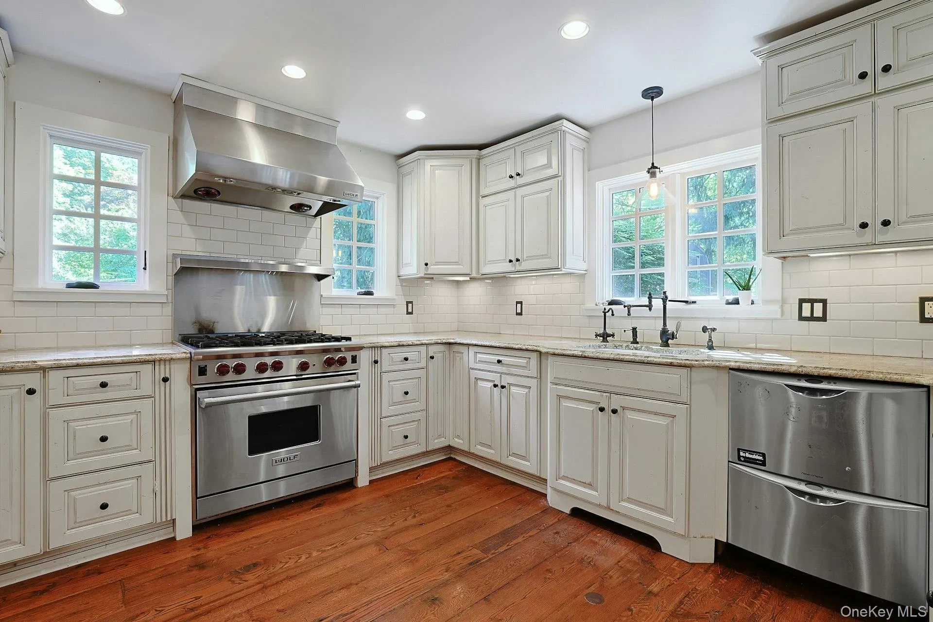 A beautifully designed gourmet kitchen offers timeless style for preparing your daily cuisine A beautifully designed gourmet kitchen offers timeless style for preparing your daily cuisine