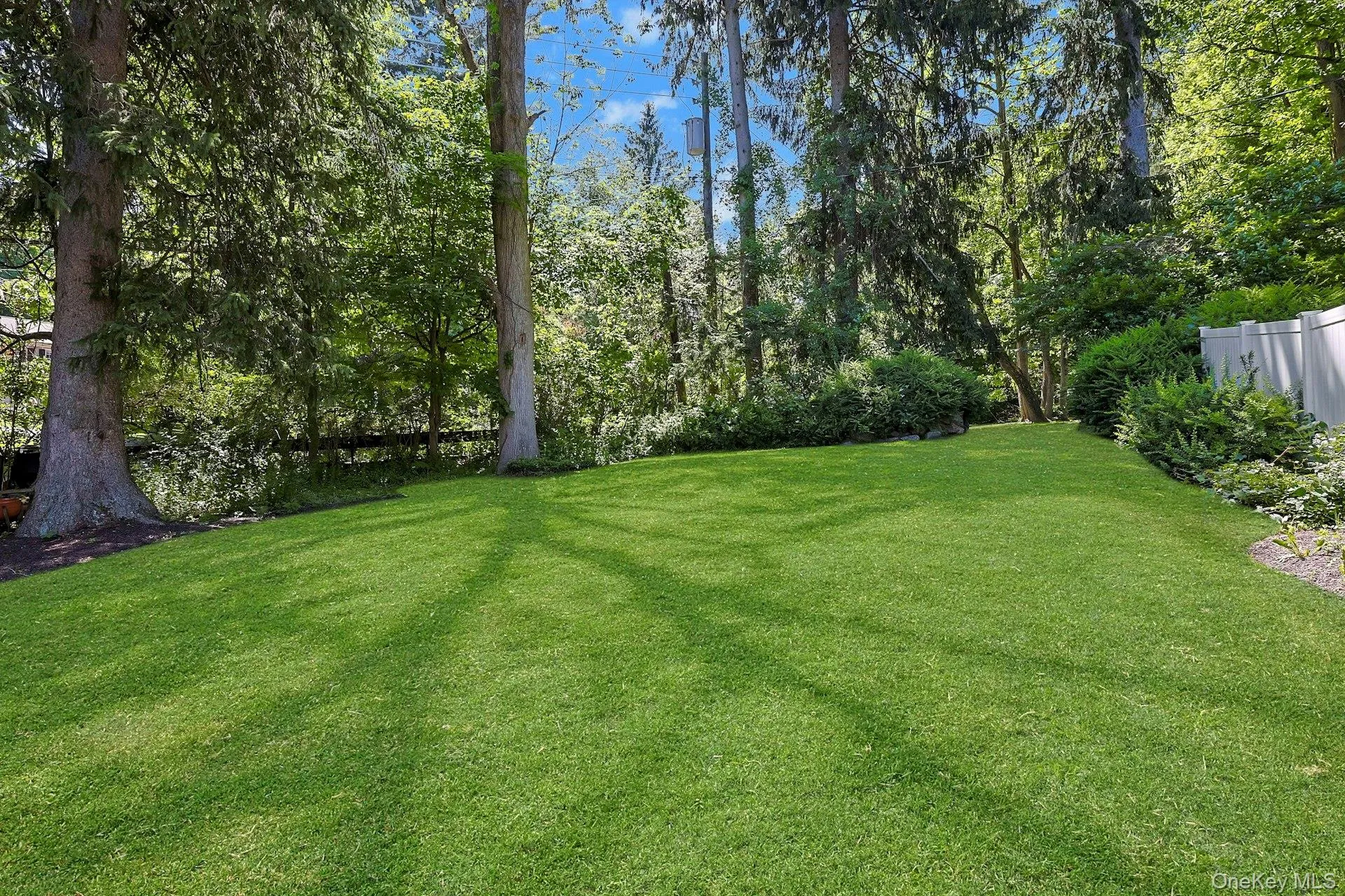 With so much outdoor space to enjoy, the yard creates a beautiful setting for gatherings. With so much outdoor space to enjoy, the yard creates a beautiful setting for gatherings.