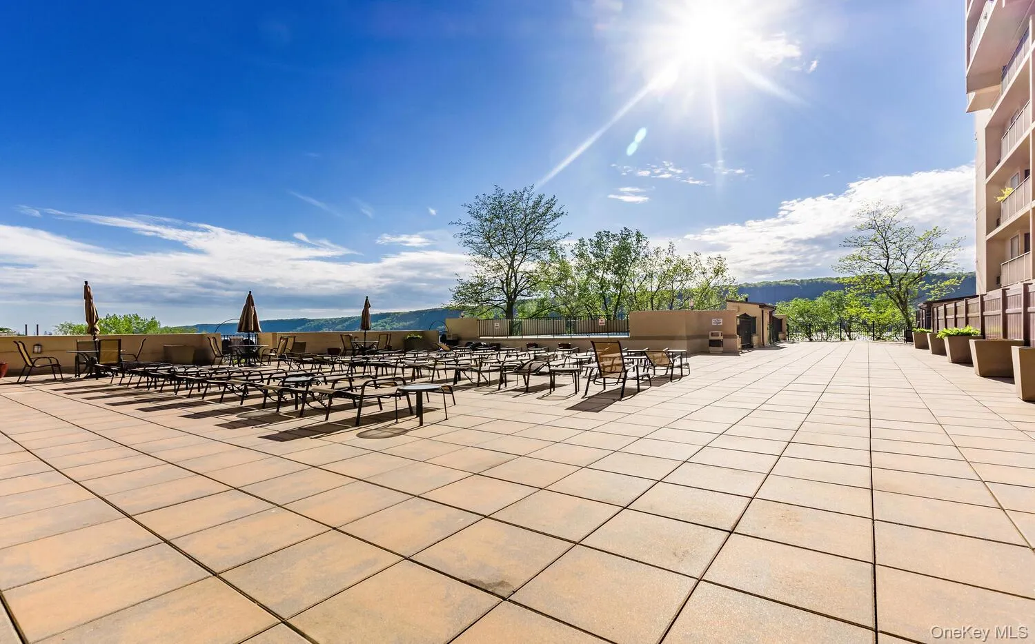 Expansive outdoor patio featuring large format pavers Expansive outdoor patio featuring large format pavers