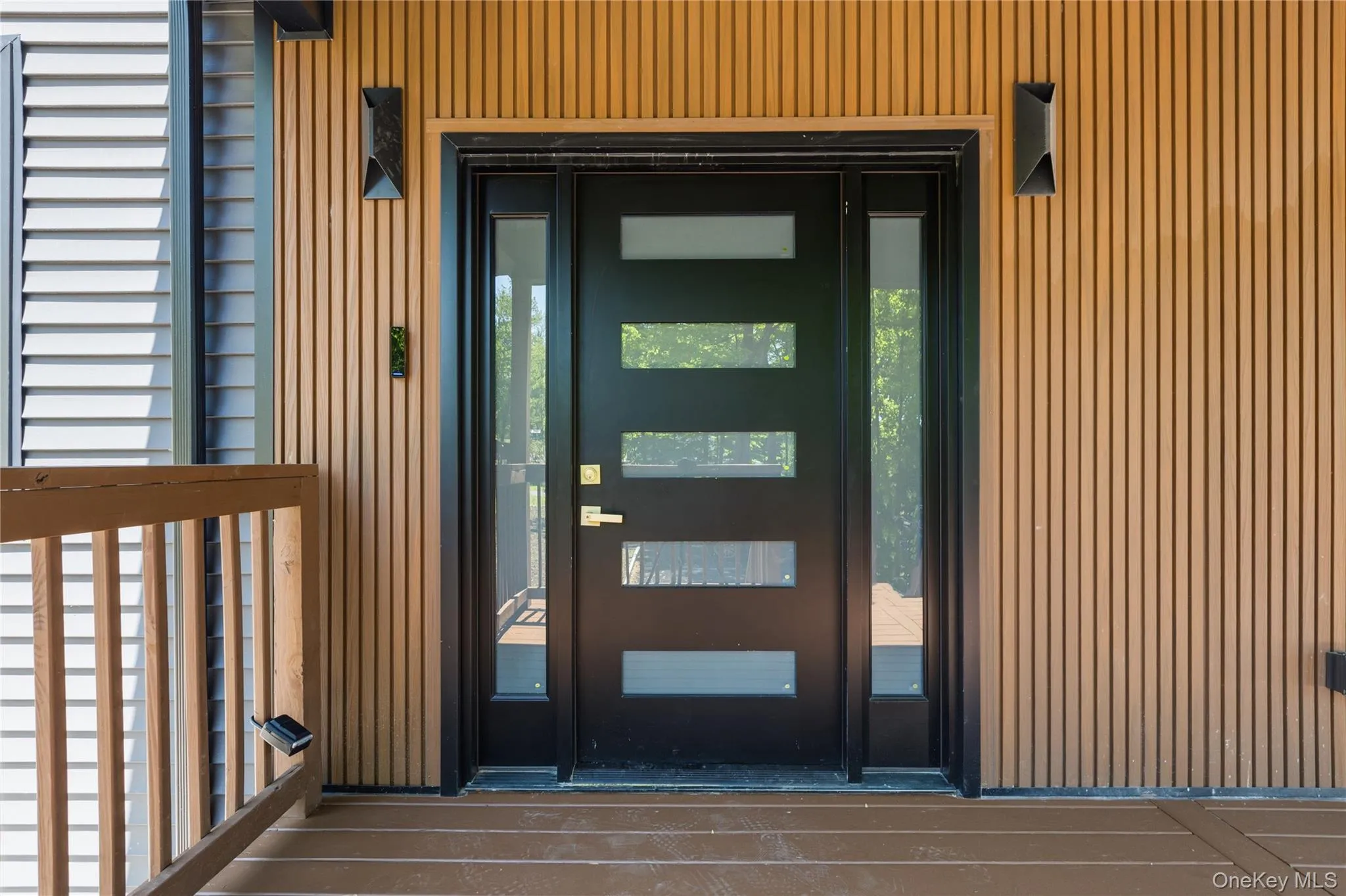 Modern black entry door with frosted glass panels and side lights Modern black entry door with frosted glass panels and side lights