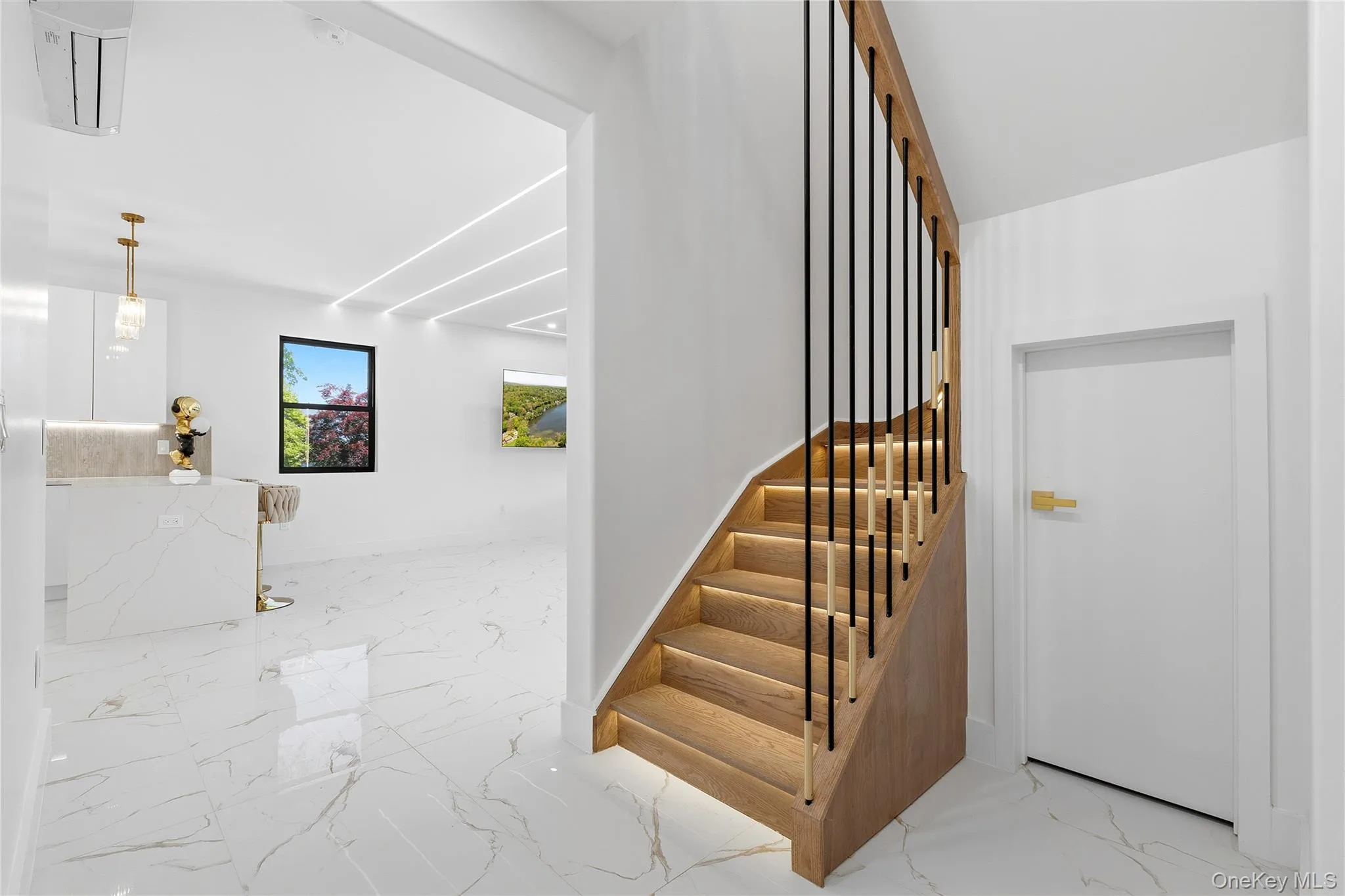 Hardwood staircase with integrated lighting and black metal balusters Hardwood staircase with integrated lighting and black metal balusters