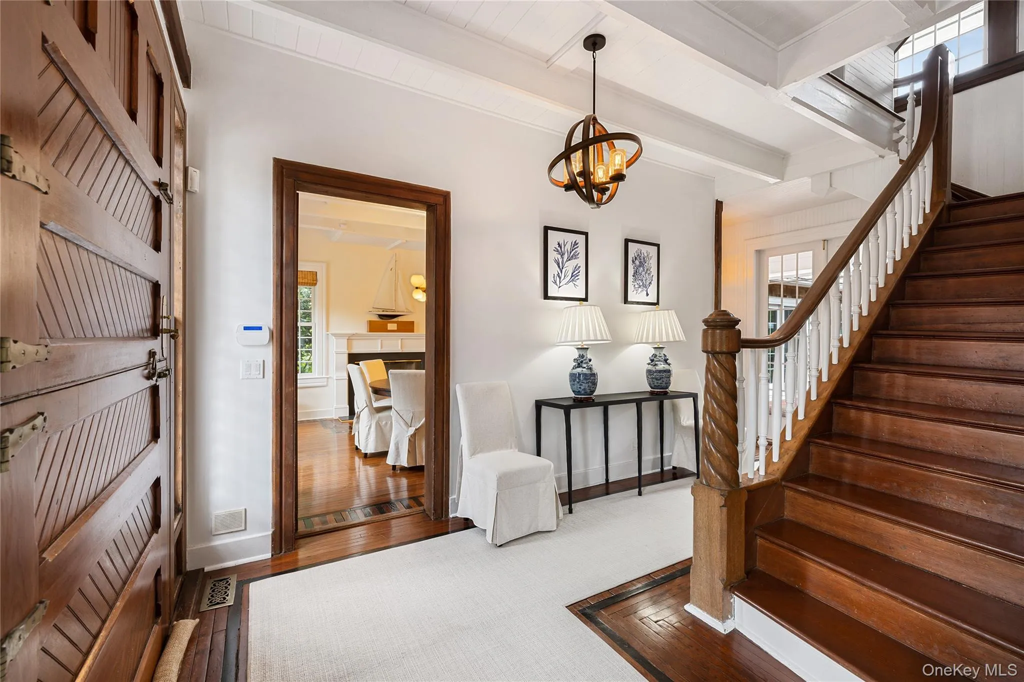 Grand original staircase accented by spiral banister