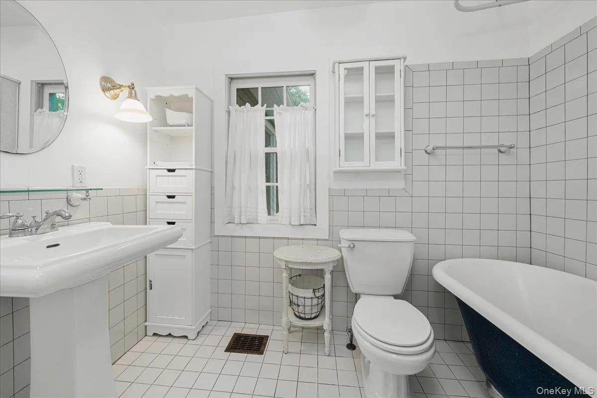 Classic elegance of a claw foot tub and glazed tiles. Classic elegance of a claw foot tub and glazed tiles.