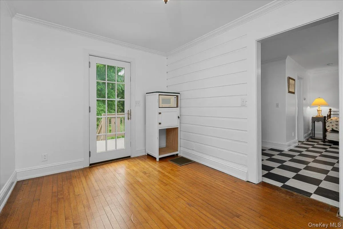 Looking toward rear door; L-shaped room seen on right. Looking toward rear door; L-shaped room seen on right.