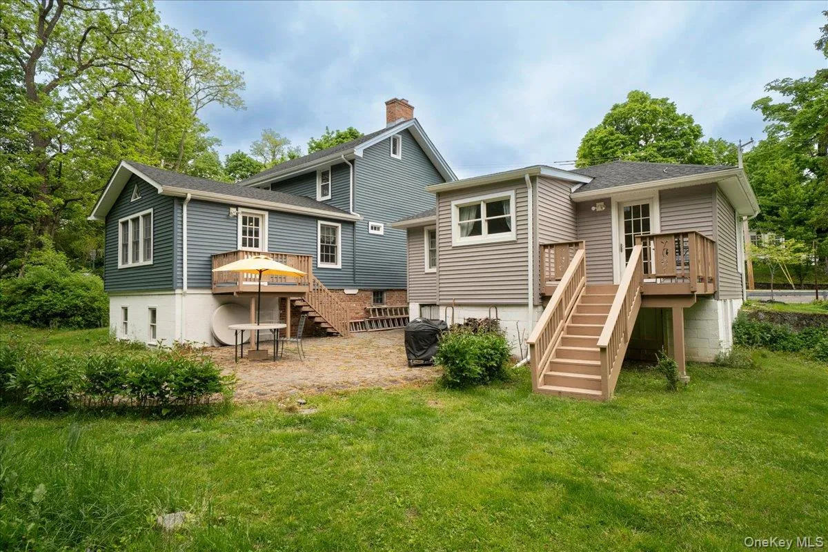 Cottage and deck on right, main residence and patio on left. Cottage and deck on right, main residence and patio on left.