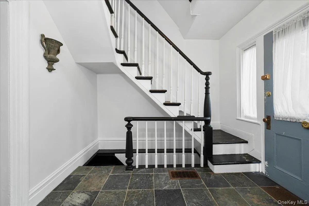 Stairs to upper floors and basement. Stairs to upper floors and basement.