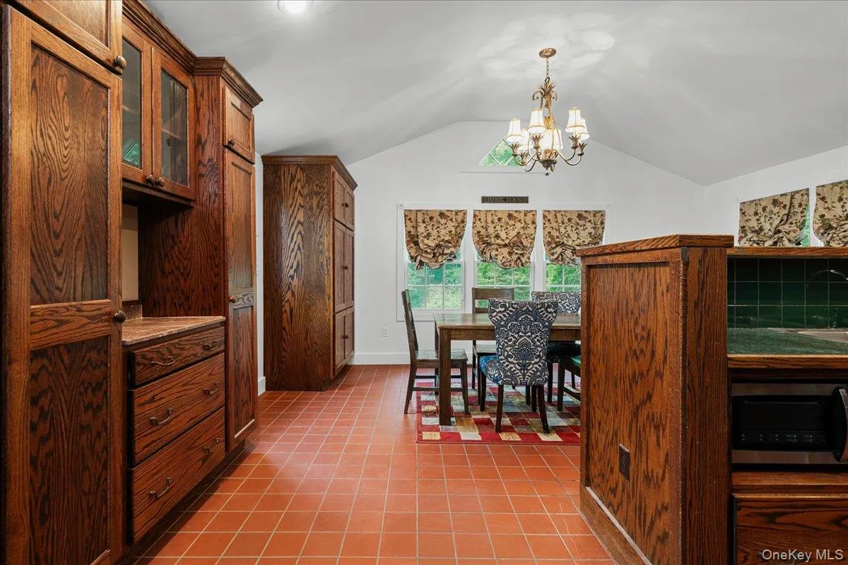 Seen with terra cotta flooring as you enter from the living room. Seen with terra cotta flooring as you enter from the living room.