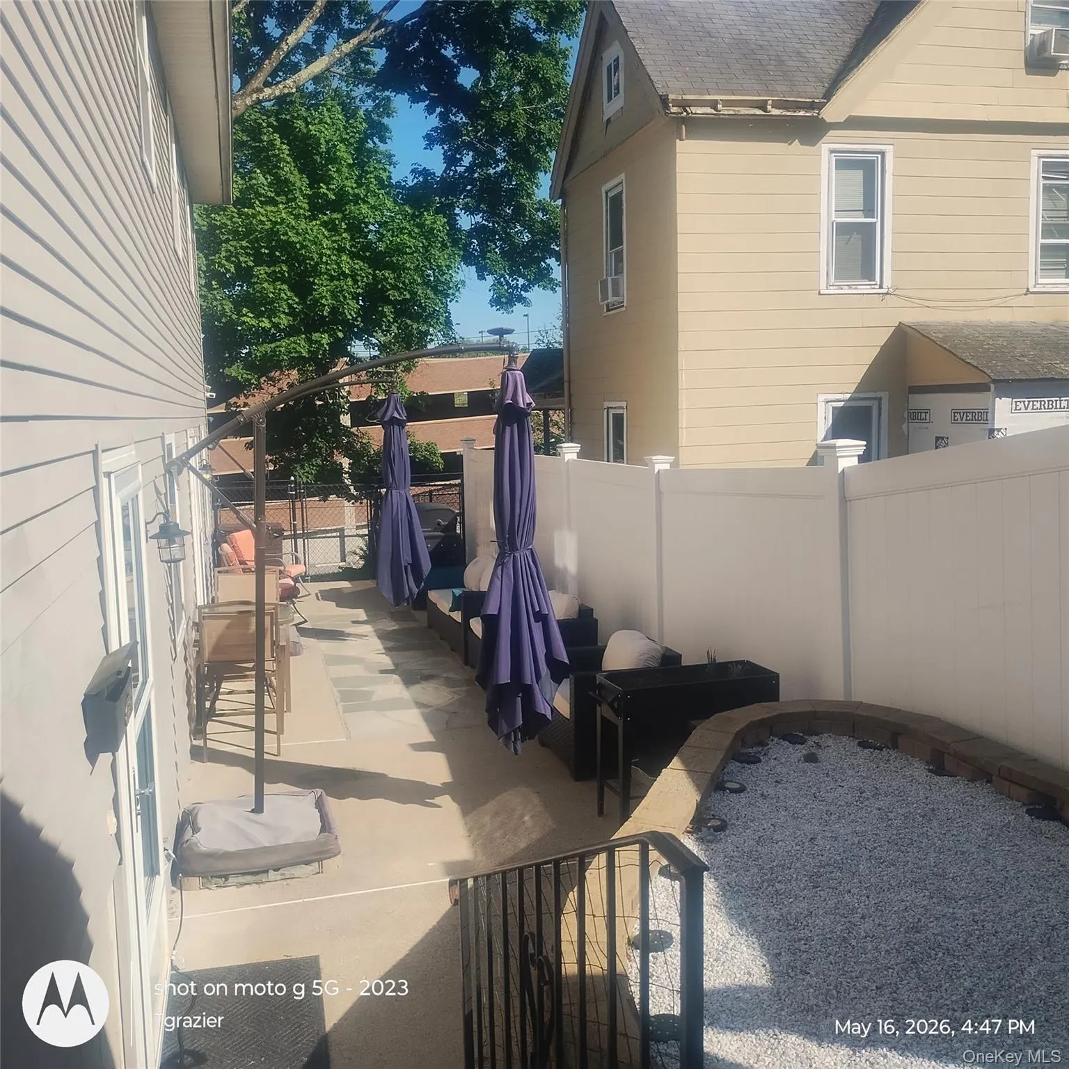 photo from driveway/steps to patio and entry to apartment. Suny Orange building in the background. photo from driveway/steps to patio and entry to apartment. Suny Orange building in the background.