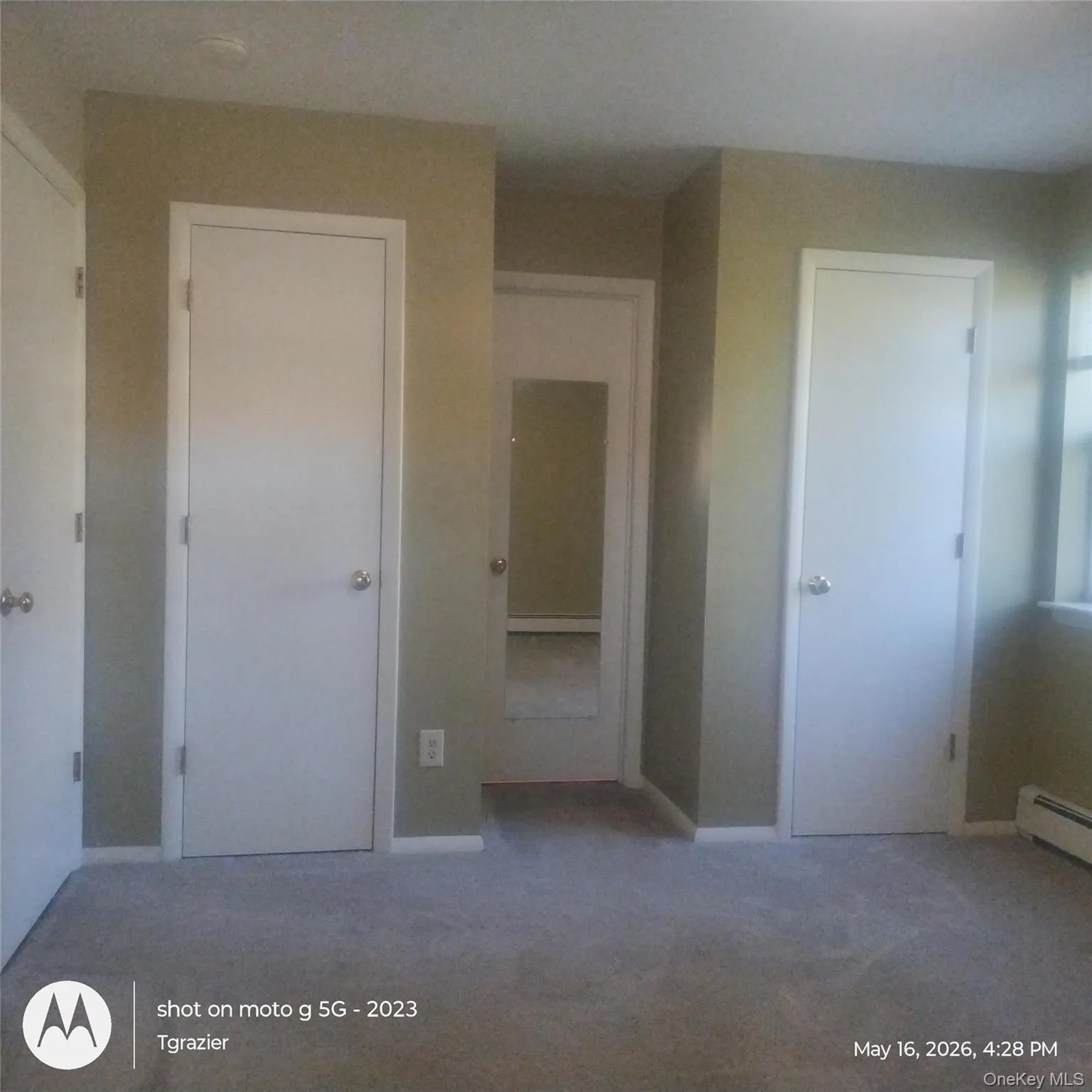 BR1, view from far wall of twin closets flanking private door to bath. BR1, view from far wall of twin closets flanking private door to bath.