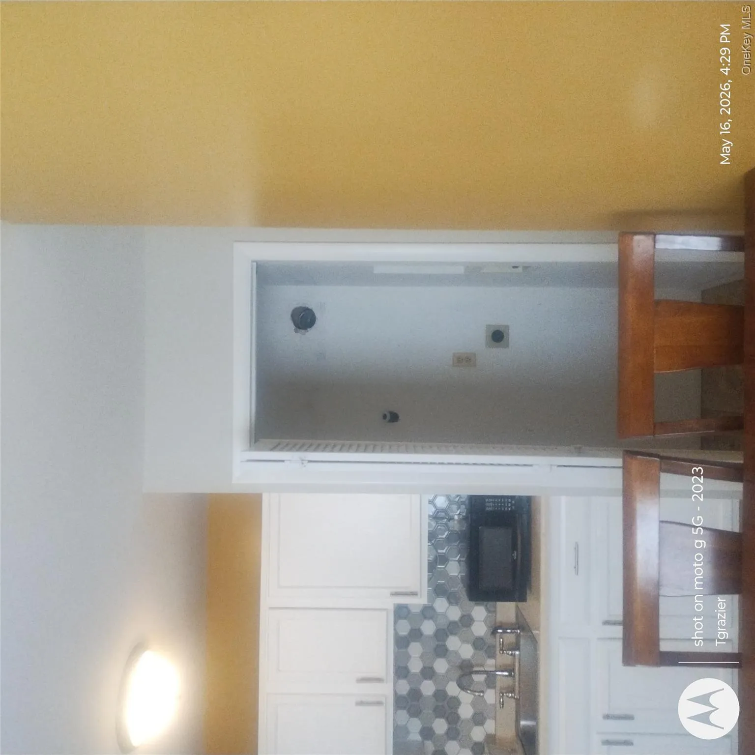 View of laundry located in kitchen. View of laundry located in kitchen.