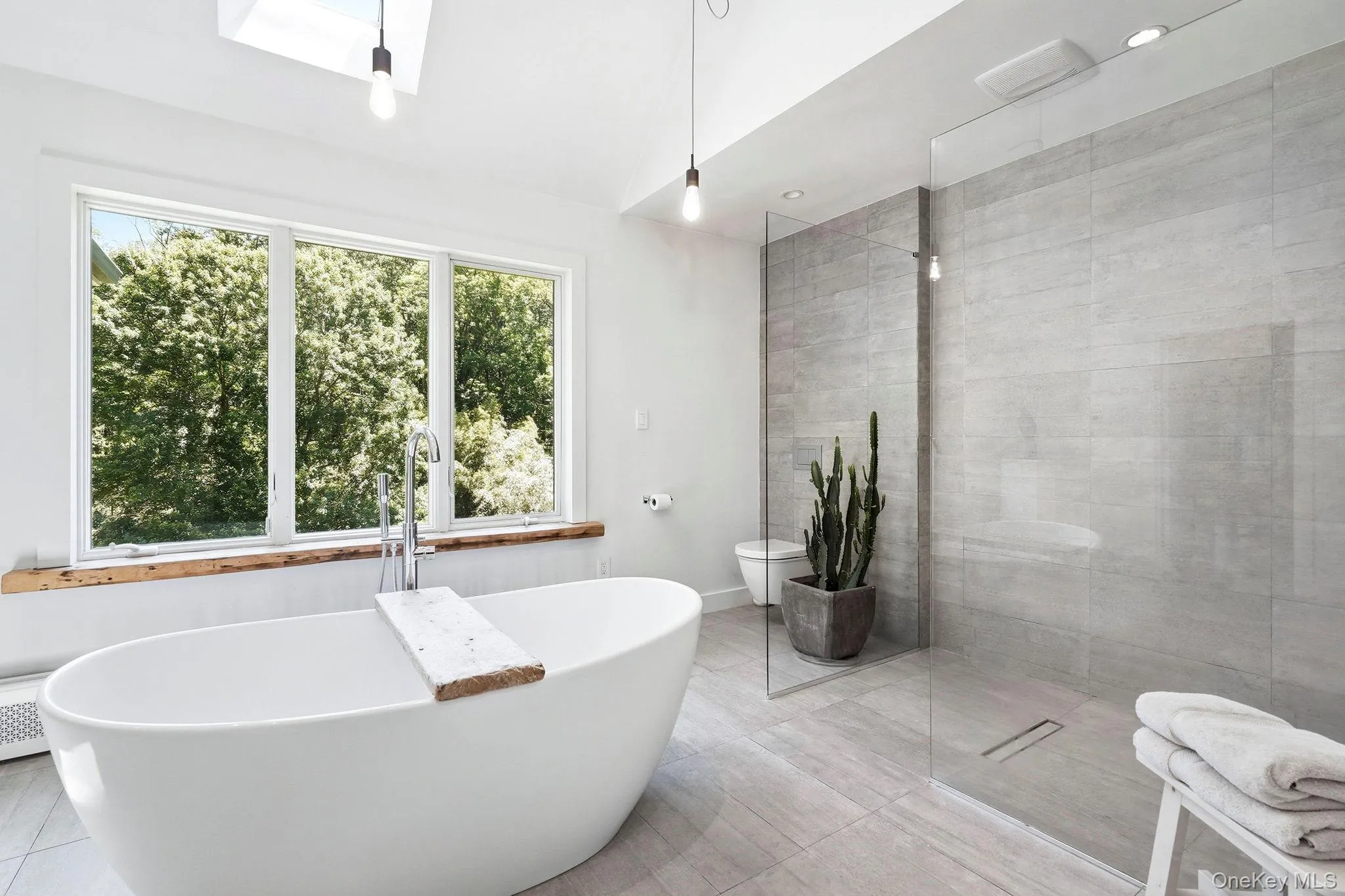 The spa-like primary bathroom leads to the sleeping quarter from one door and to the quite large walk in closet. The spa-like primary bathroom leads to the sleeping quarter from one door and to the quite large walk in closet.