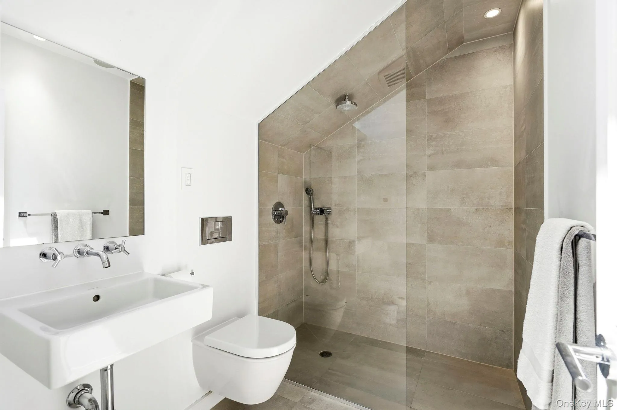Third floor ensuite with high end fixtures and radiant floors. Third floor ensuite with high end fixtures and radiant floors.