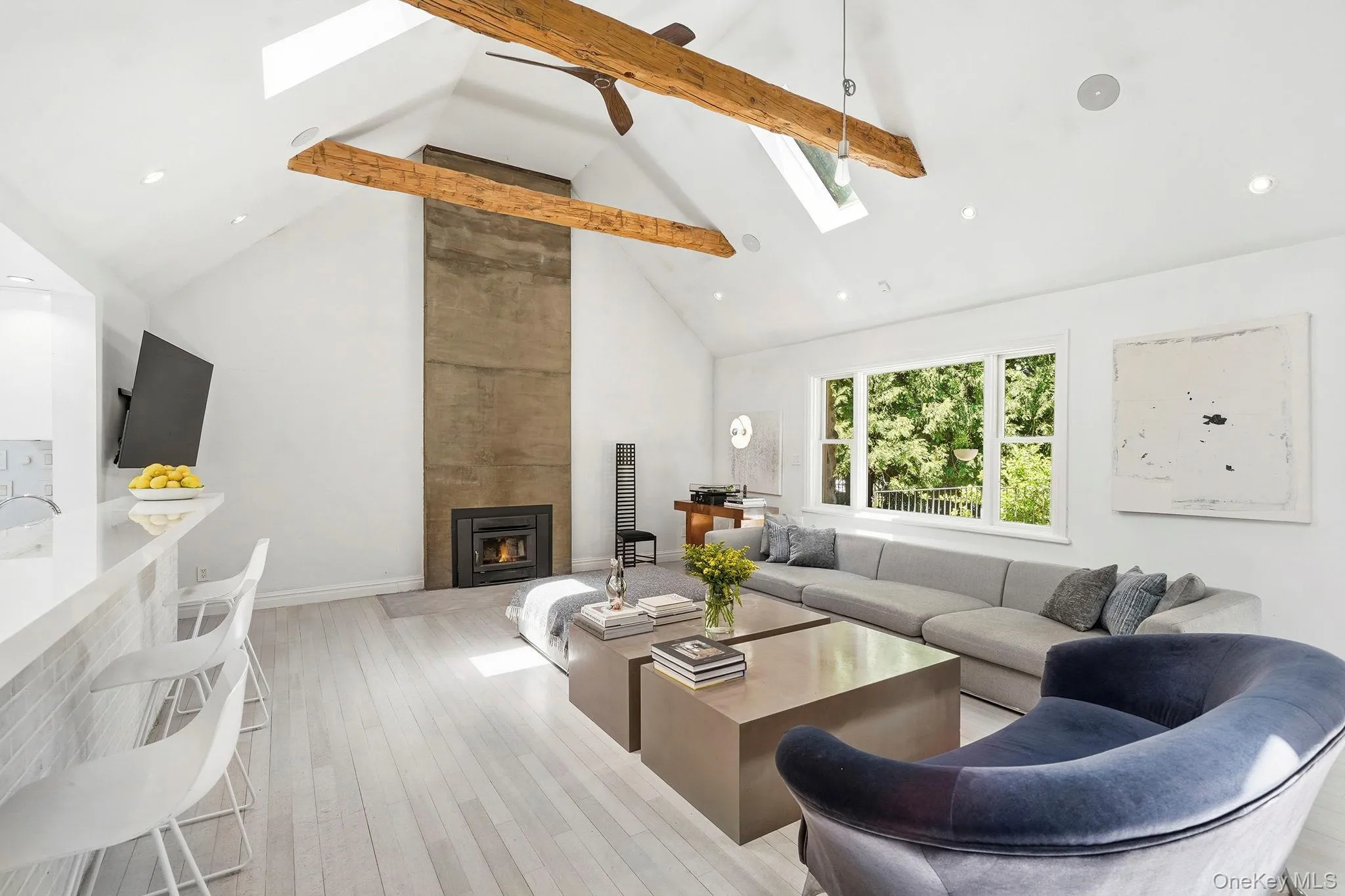 Lightened cherry floors throughout the home. Vaulted ceiling with concrete fireplace, a dramatic modern focal point. 11 ft ceilings throughout. Lightened cherry floors throughout the home. Vaulted ceiling with concrete fireplace, a dramatic modern focal point. 11 ft ceilings throughout.