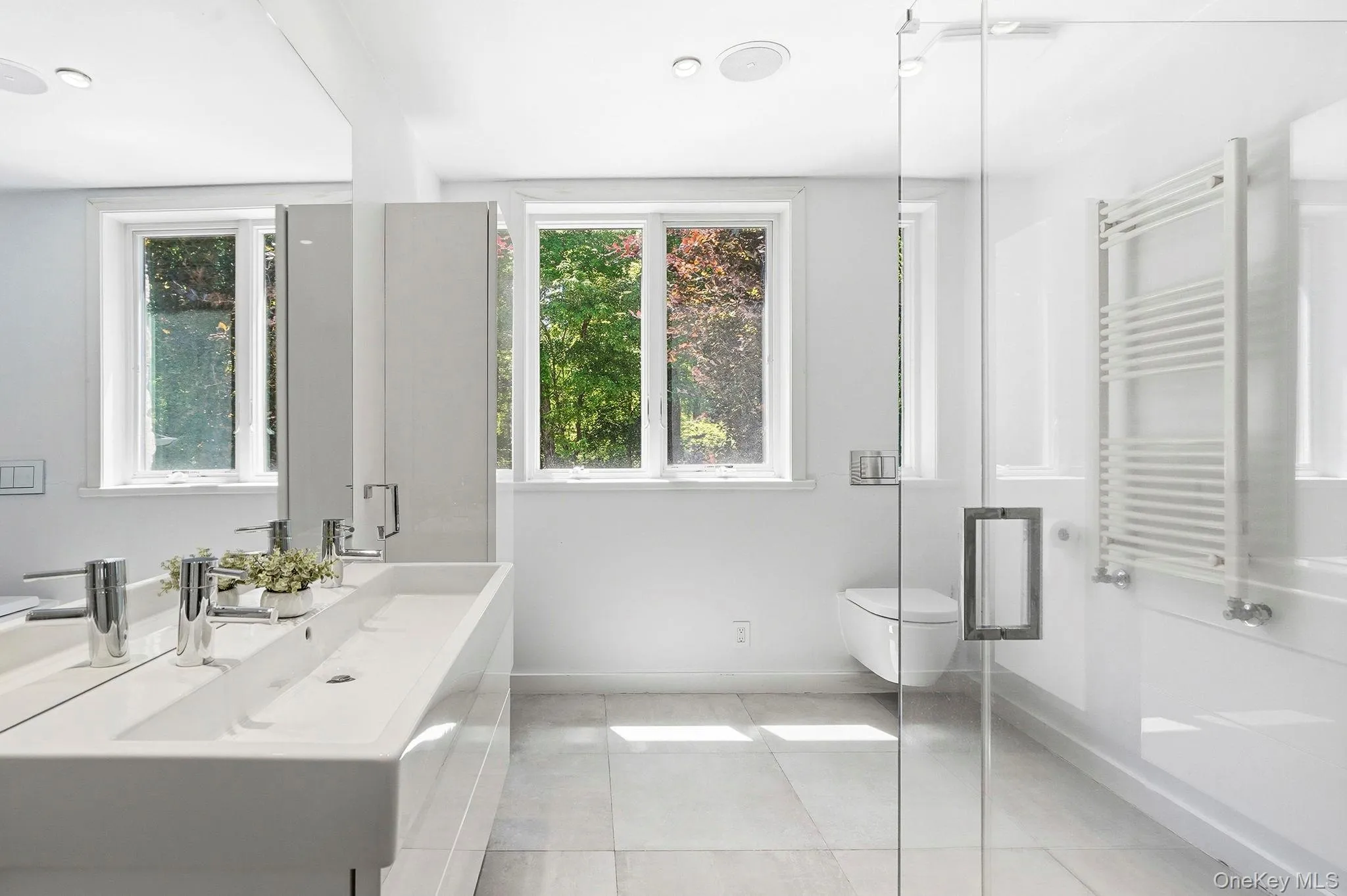 Full hallway bathroom shared by 2 bedrooms. All bathrooms have radiant heated flooring. Full hallway bathroom shared by 2 bedrooms. All bathrooms have radiant heated flooring.