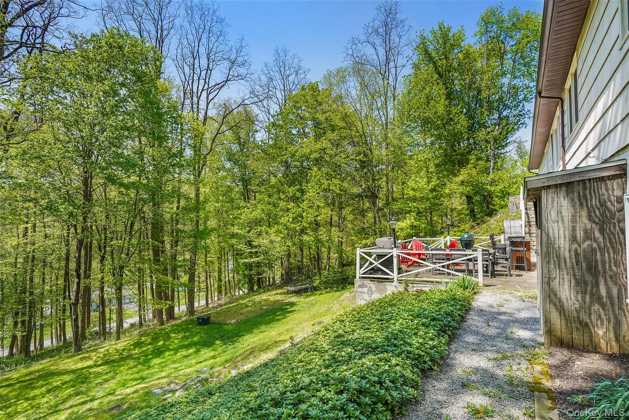View of rear patio and lower backyard area. View of rear patio and lower backyard area.