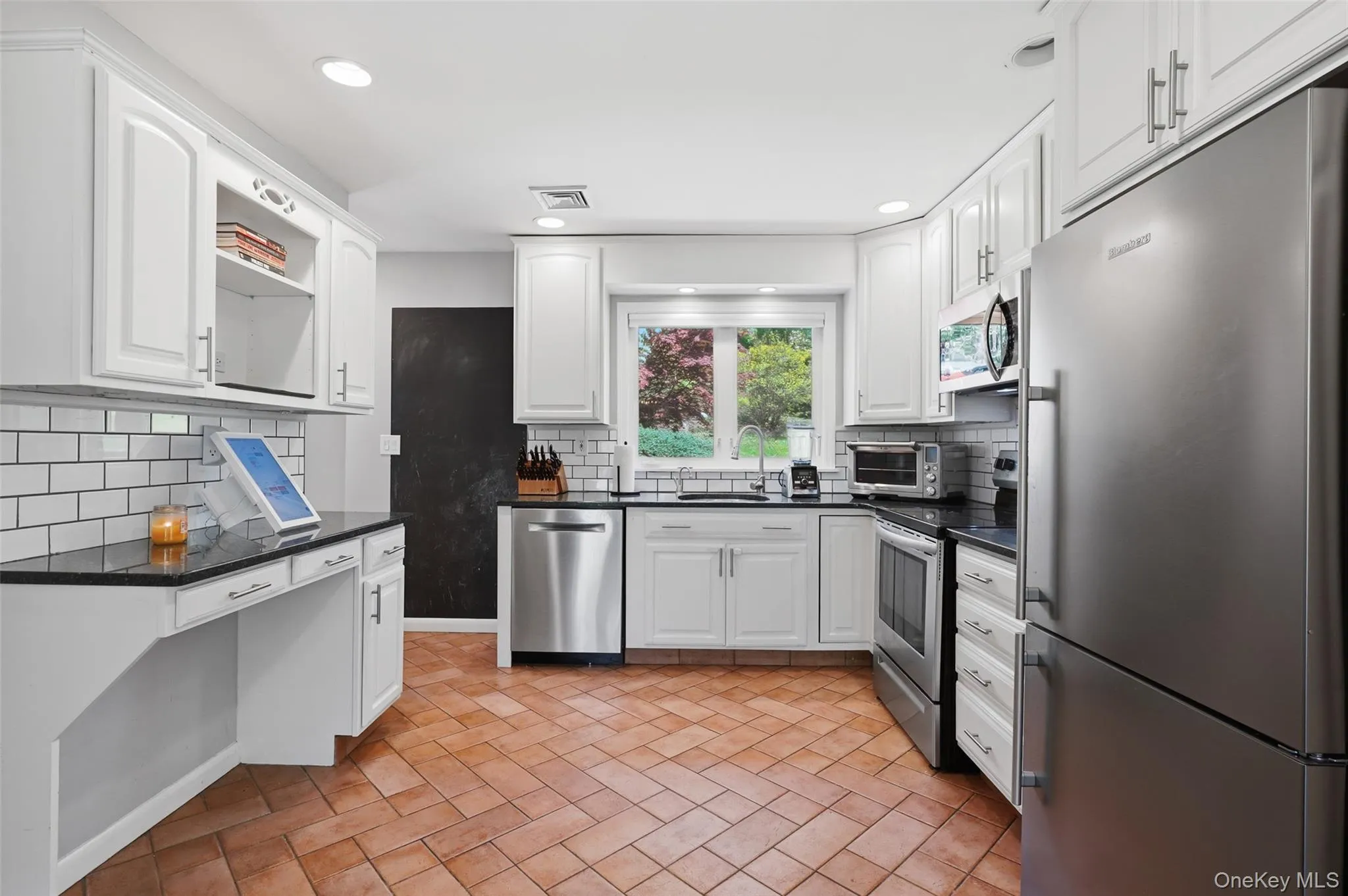 Kitchen view with desk counter. Kitchen view with desk counter.