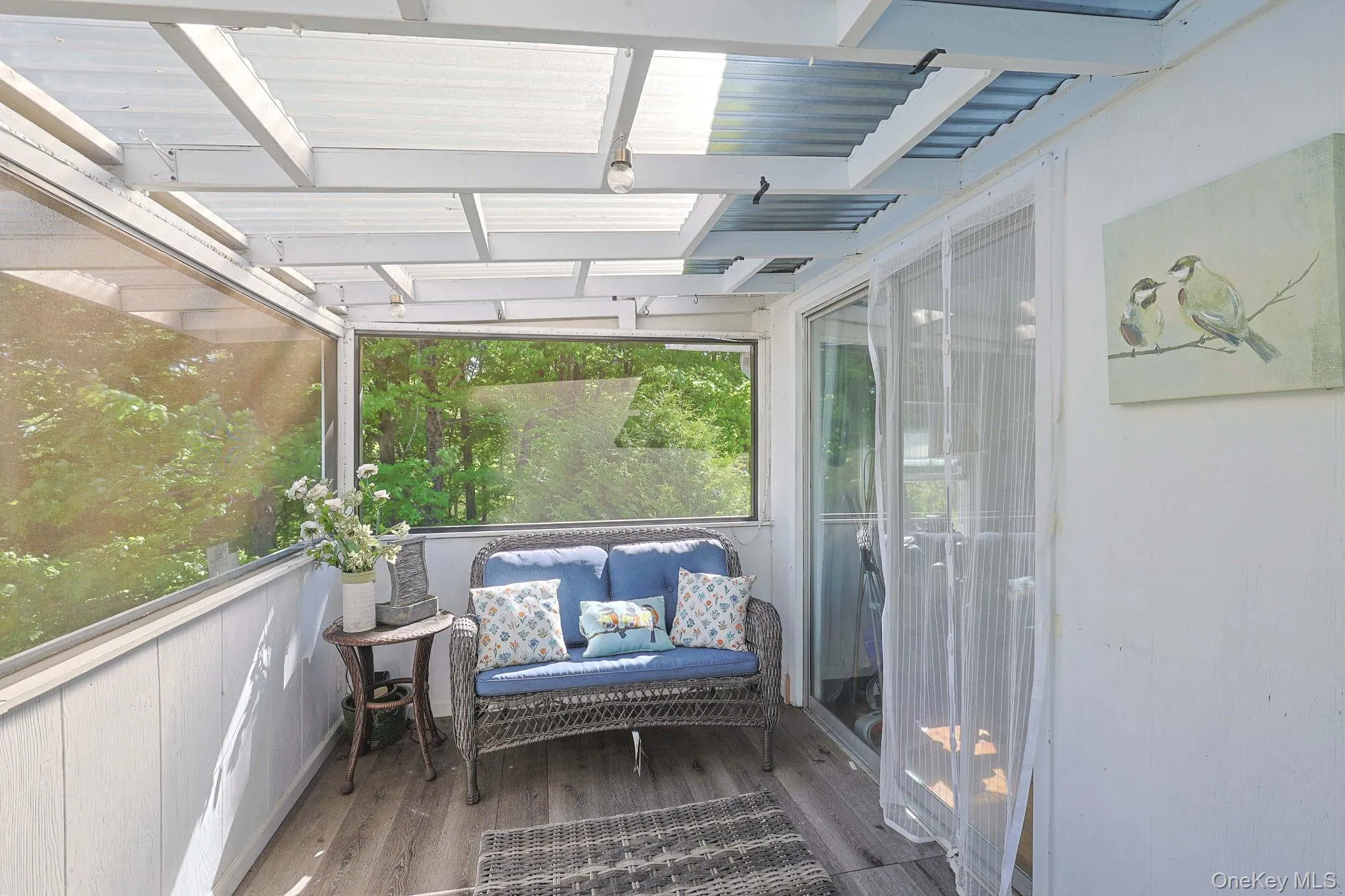 Upstairs Enclosed Balcony off of the Den Upstairs Enclosed Balcony off of the Den