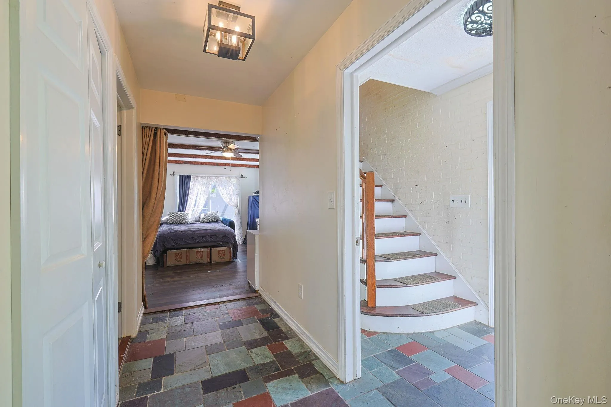 Entrance Foyer leading straight to the Family Room and Upstairs to the Accessory Apartment Entrance Foyer leading straight to the Family Room and Upstairs to the Accessory Apartment