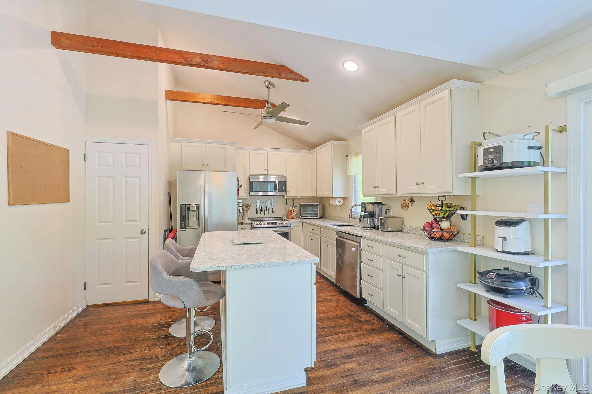 Stunning Kitchen with granite countertops, Cathedral ceiling and wood beams Stunning Kitchen with granite countertops, Cathedral ceiling and wood beams