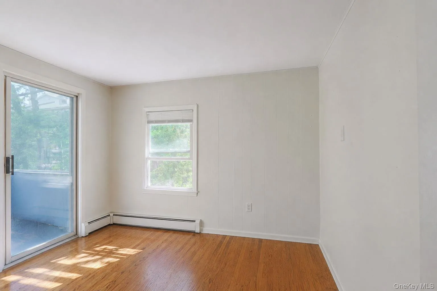 Upstairs Office with sliders leading out to enclosed balcony Upstairs Office with sliders leading out to enclosed balcony