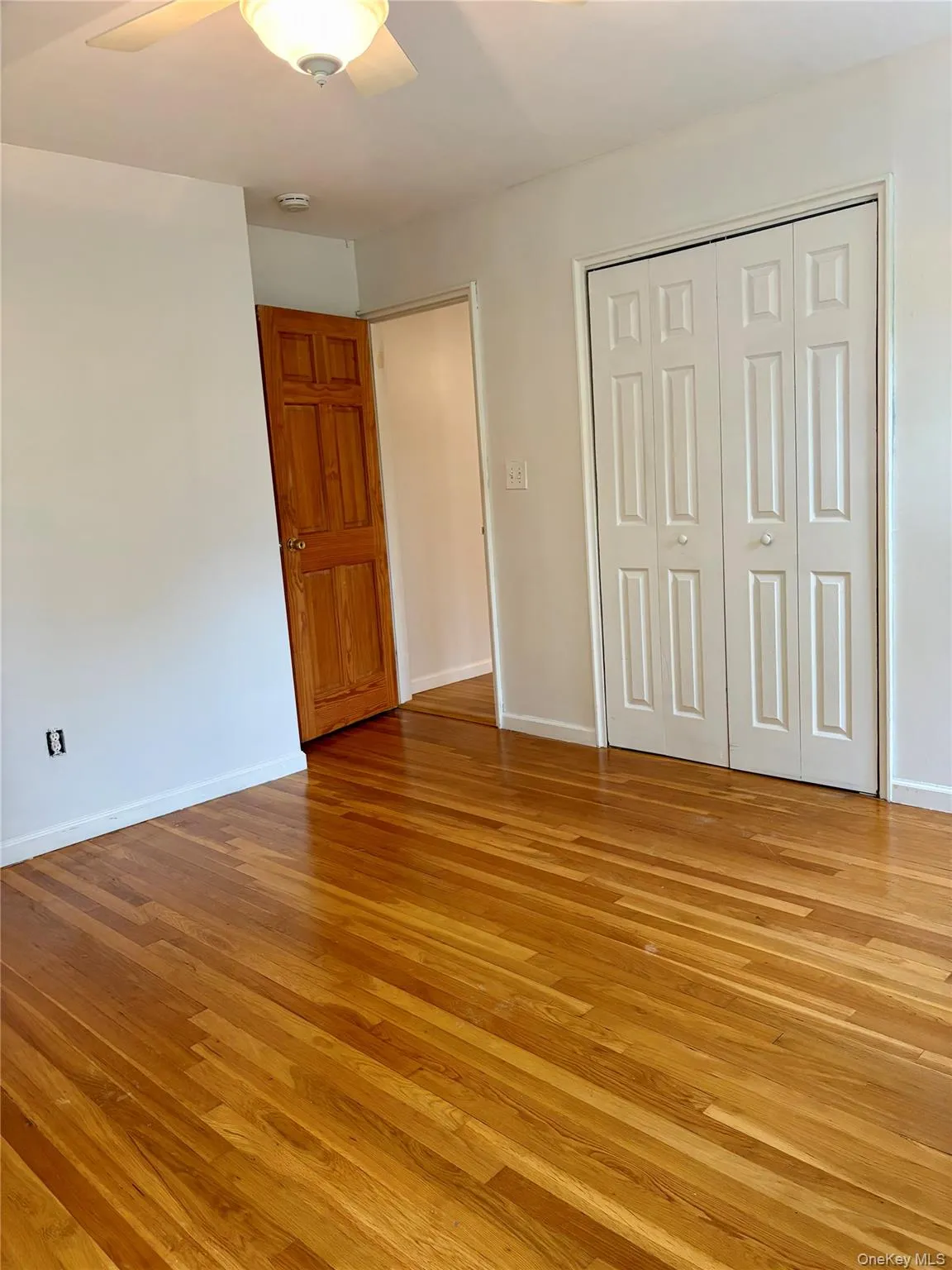 Bedroom with Large Closet and Hardwood Floors Bedroom with Large Closet and Hardwood Floors