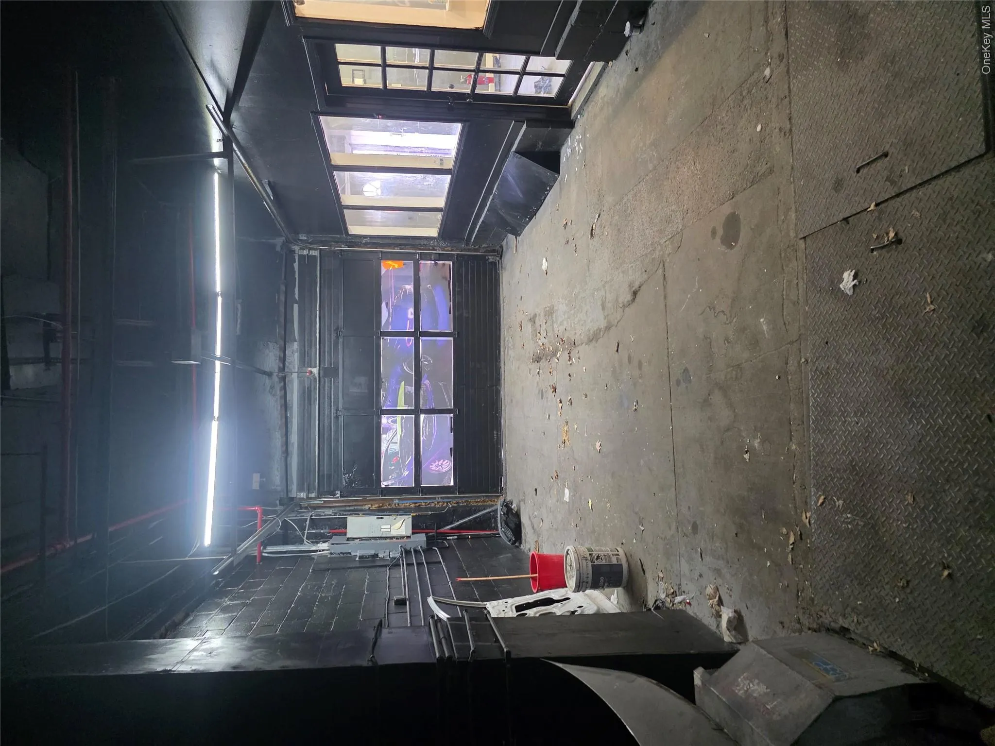 Concrete flooring with diamond plate sections Concrete flooring with diamond plate sections