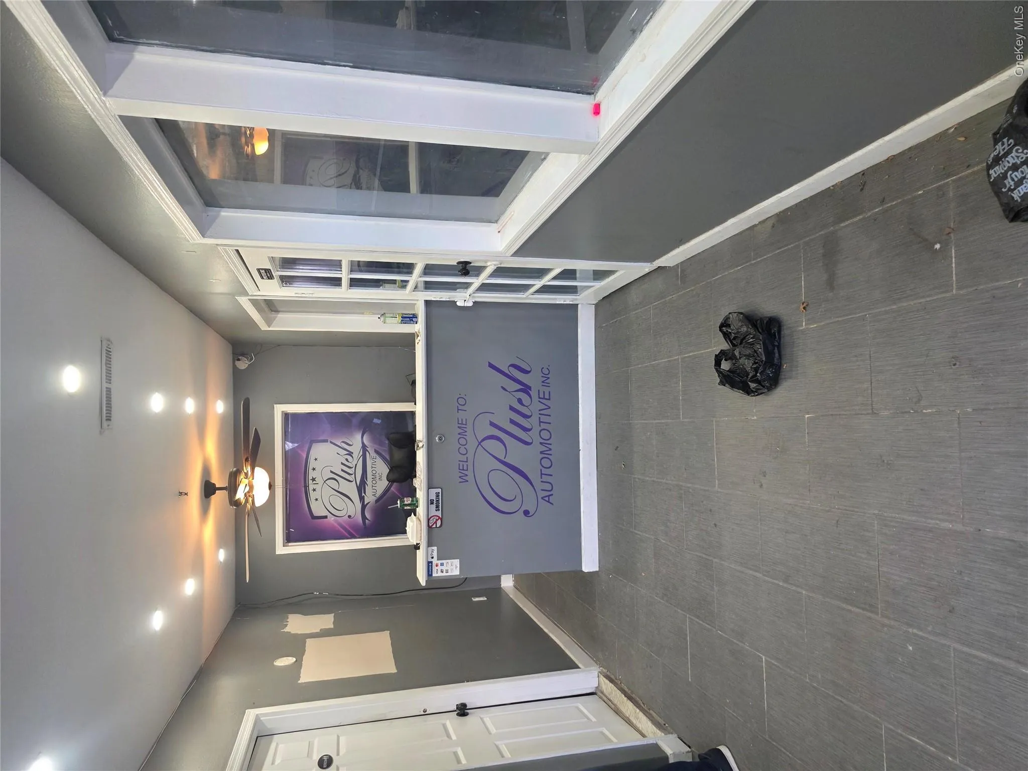 Reception area featuring a built-in counter, recessed ceiling lighting, and a ceiling fan Reception area featuring a built-in counter, recessed ceiling lighting, and a ceiling fan