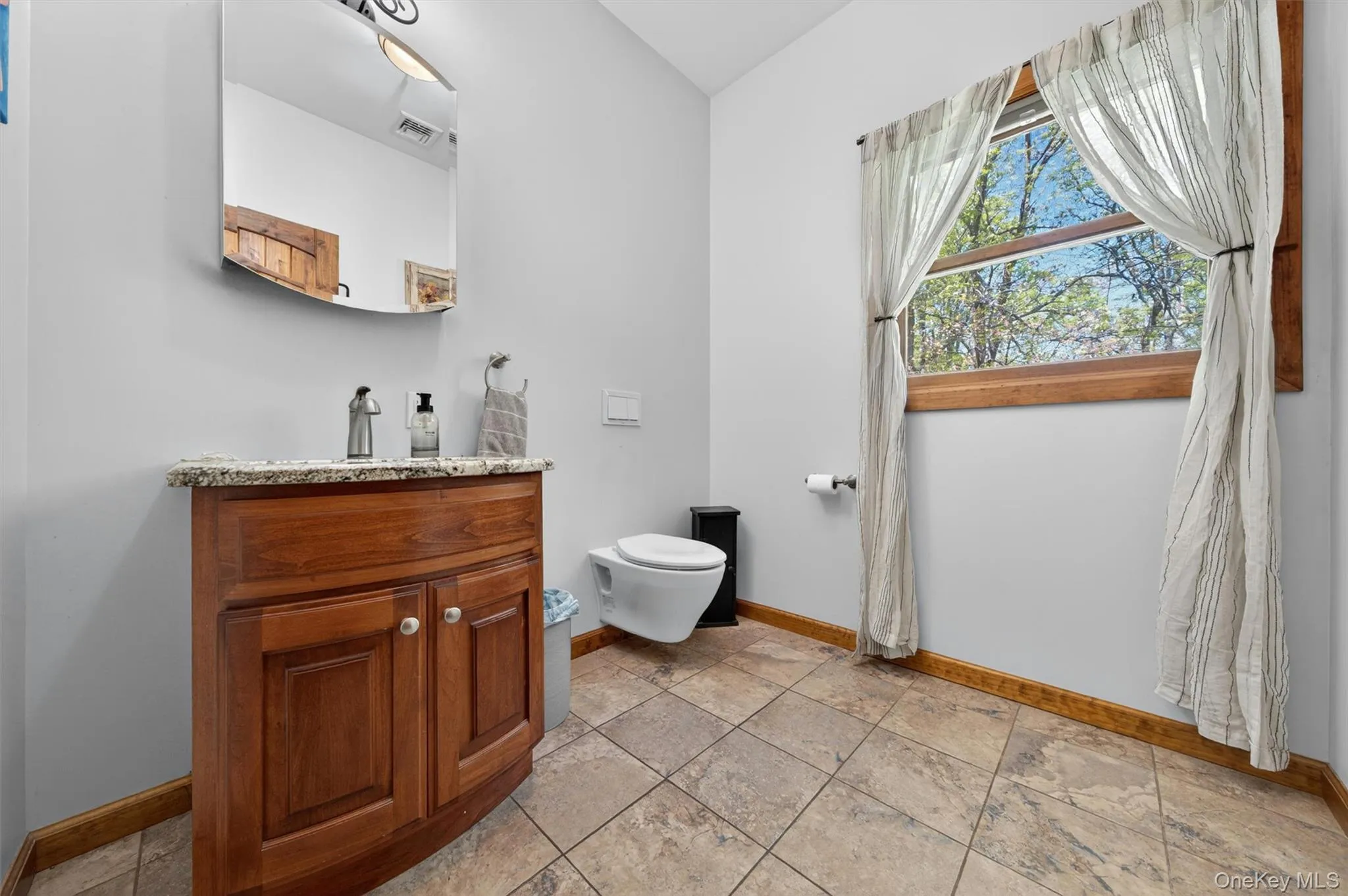 The half bath and mudroom (pictured next) complete the main floor. The half bath and mudroom (pictured next) complete the main floor.