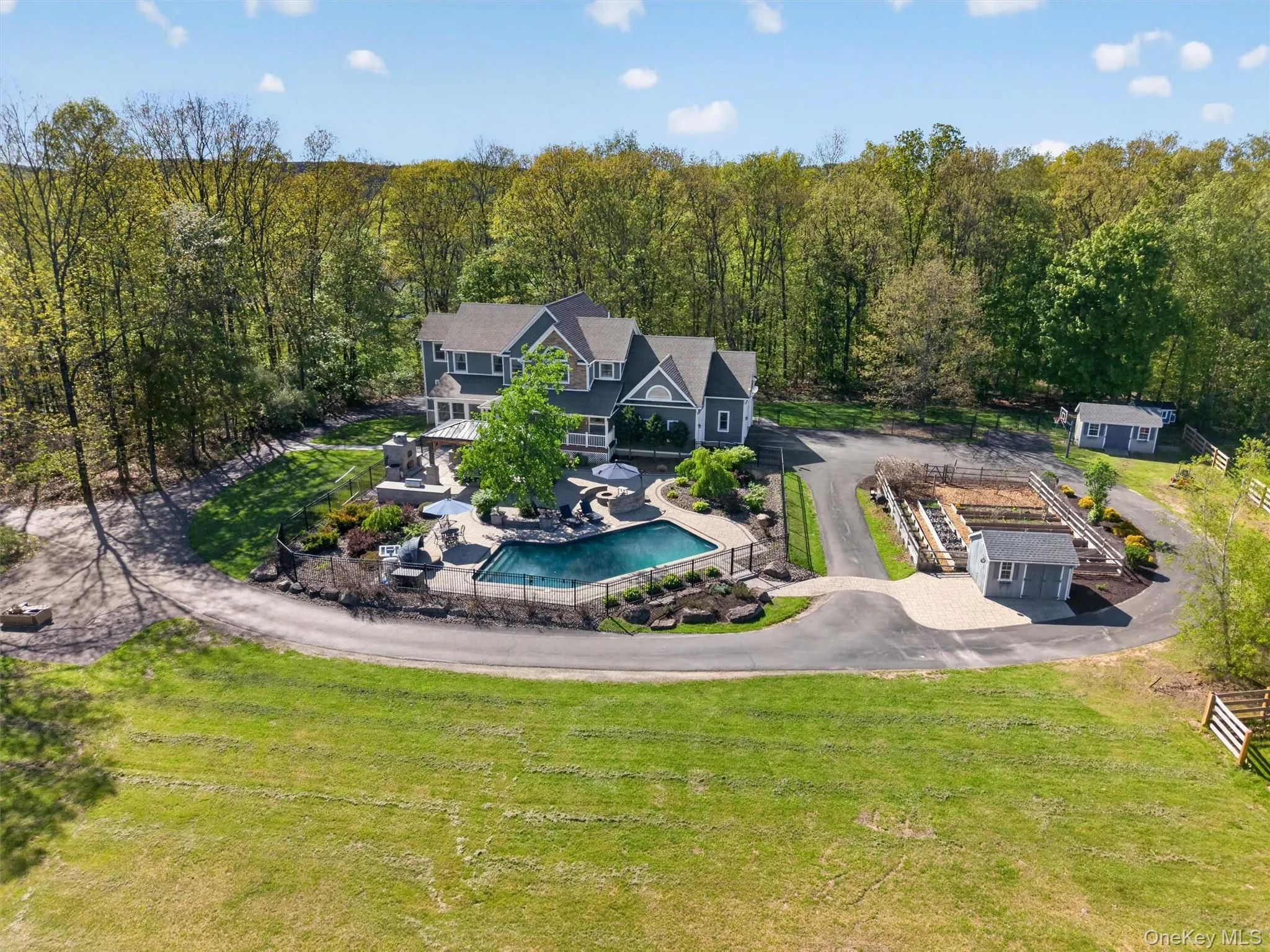 Nestled on an amazing 12.7 acres, this home provides ample space for entertaining and recreation both inside and out! Nestled on an amazing 12.7 acres, this home provides ample space for entertaining and recreation both inside and out!