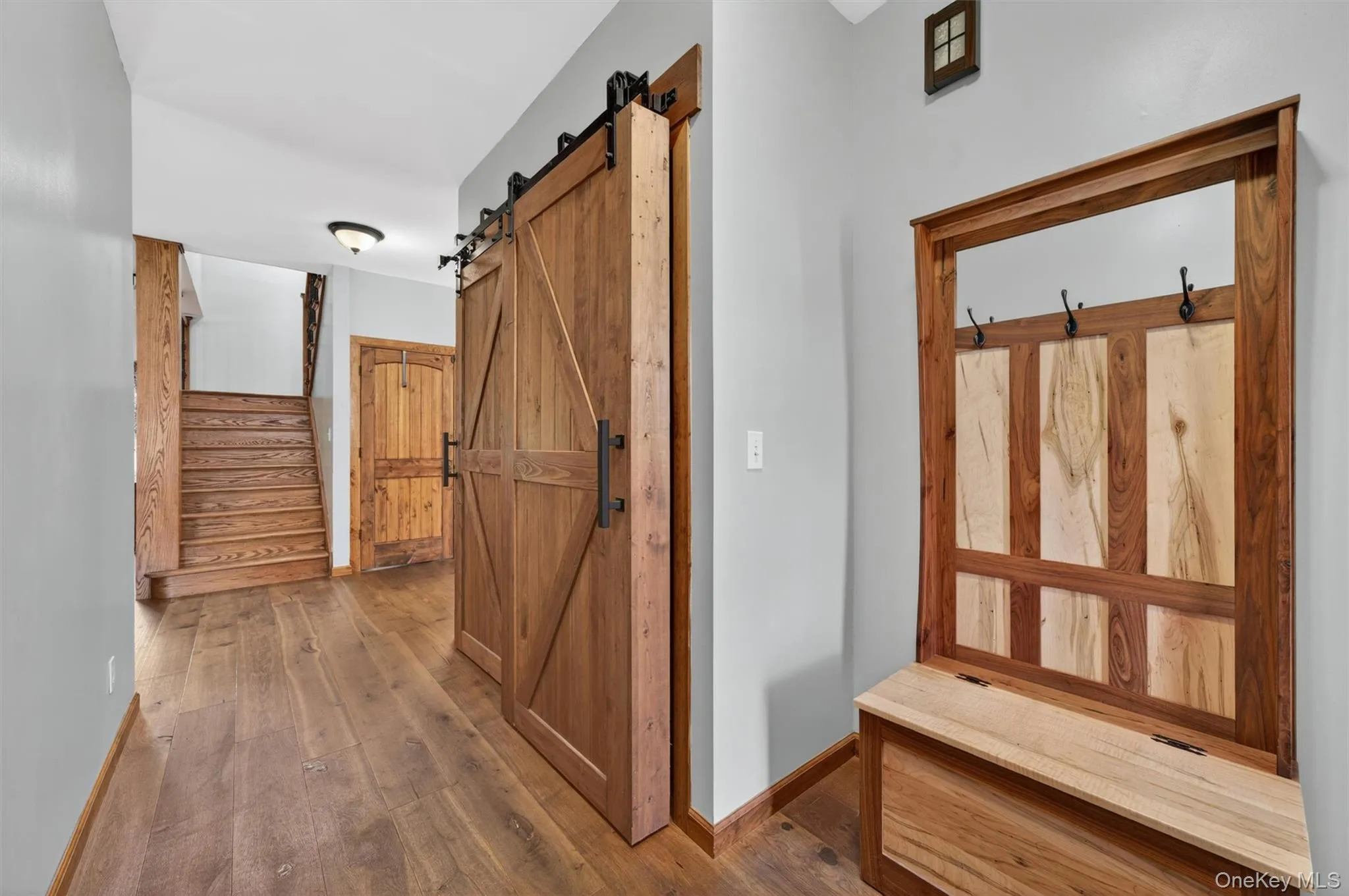 The entryway provides a warm haven from the elements and features an oversized coat closet tucked behind stylish, rustic barn doors. The entryway provides a warm haven from the elements and features an oversized coat closet tucked behind stylish, rustic barn doors.