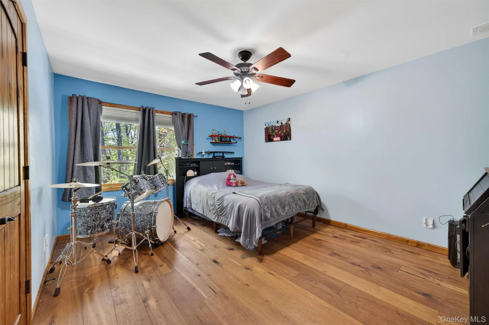 An expansive secondary bedroom featuring a flexible layout large enough for a drum set, plus the added benefit of a walk-in closet. An expansive secondary bedroom featuring a flexible layout large enough for a drum set, plus the added benefit of a walk-in closet.