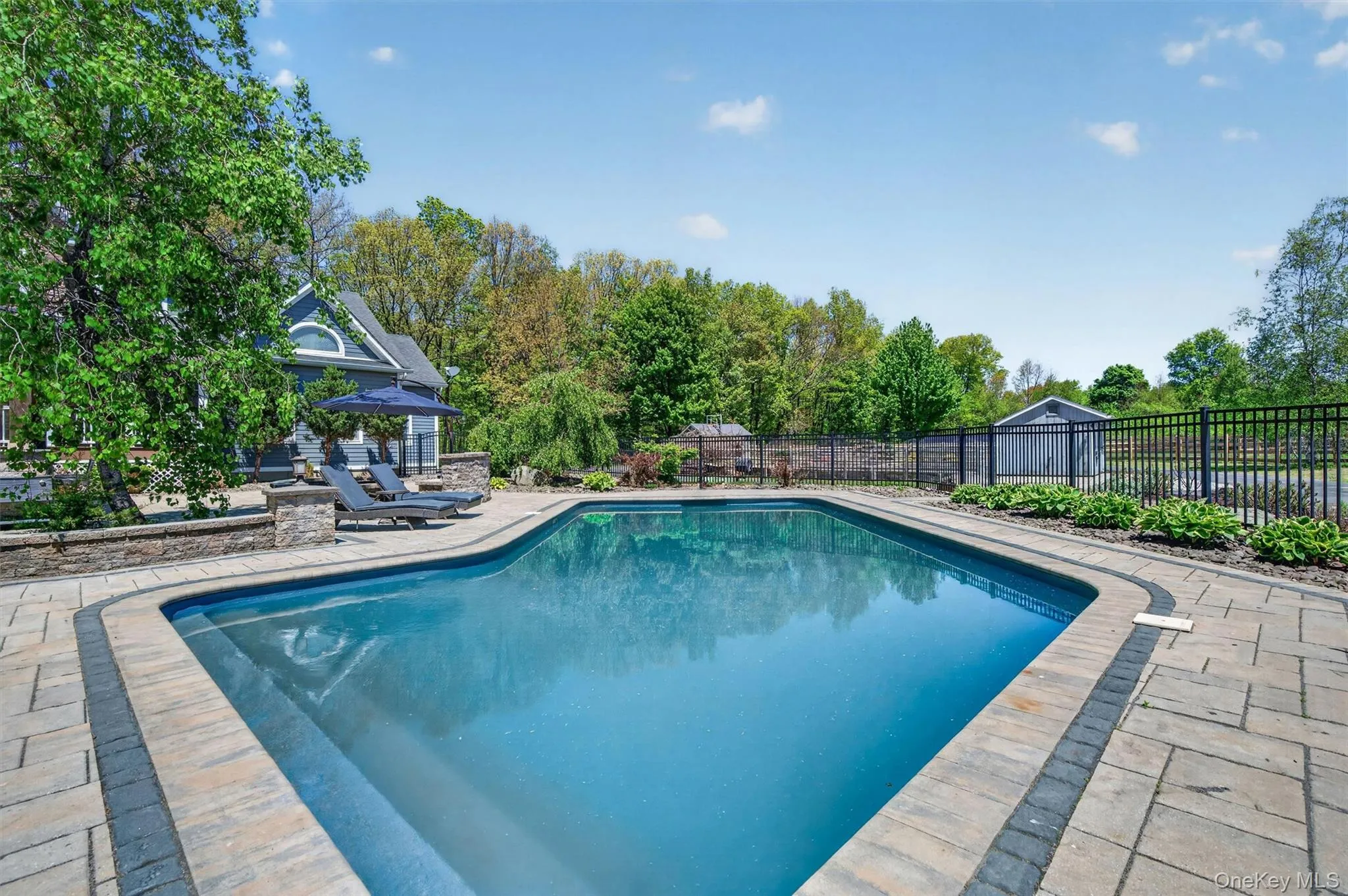 Dive into luxury with this heated saltwater pool, the perfect centerpiece for summer relaxation and poolside leisure. Dive into luxury with this heated saltwater pool, the perfect centerpiece for summer relaxation and poolside leisure.
